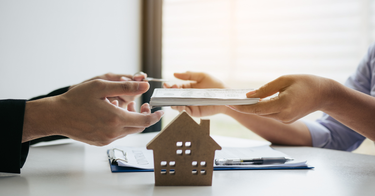 Image of buyers signing mortgage papers