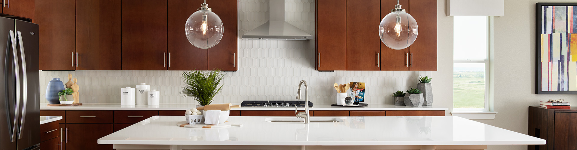 A kitchen with wooden cabinets.