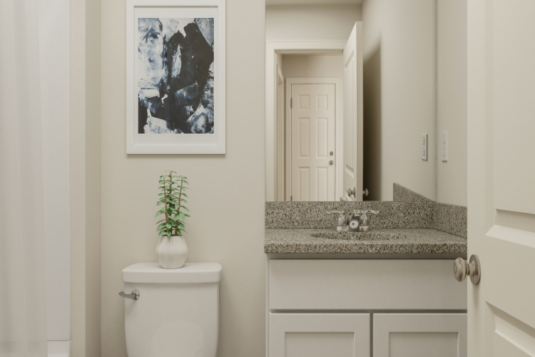 A bathroom with a marble countertop.