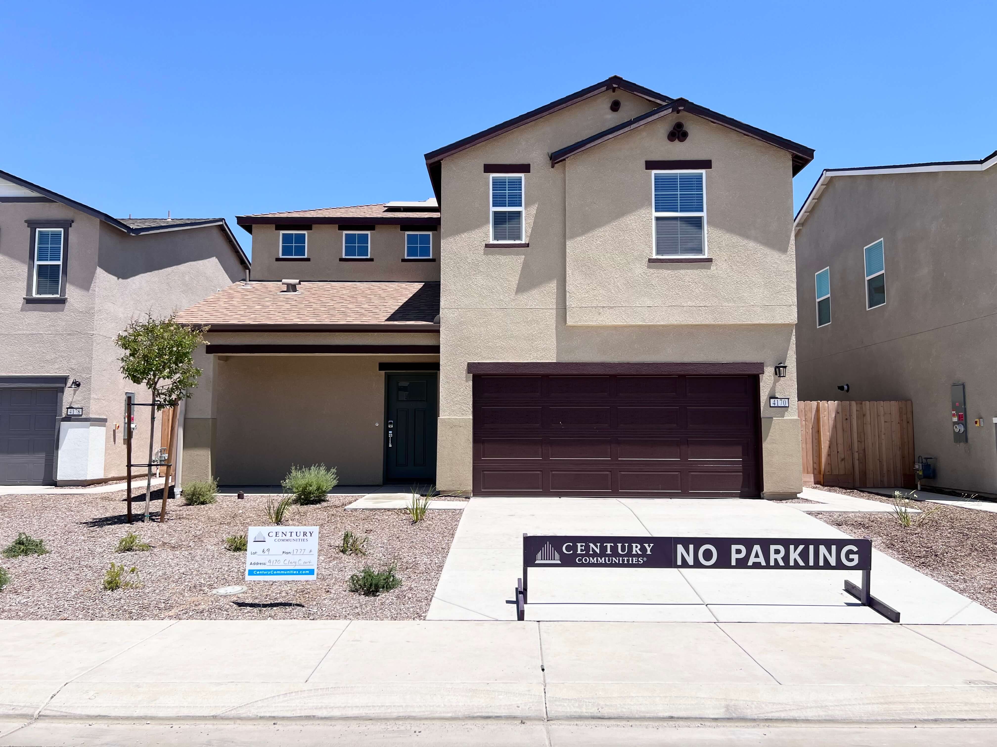 A building with a sign in front.