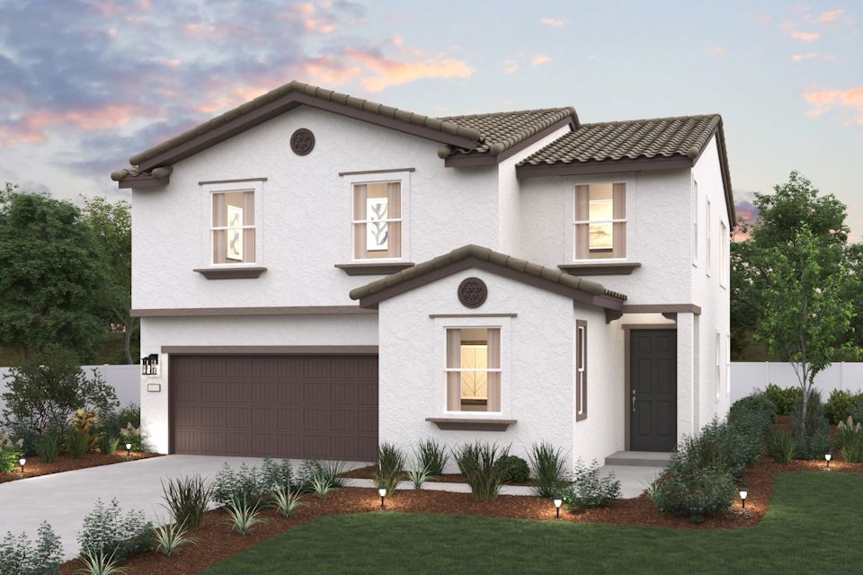 A white house with a garage.