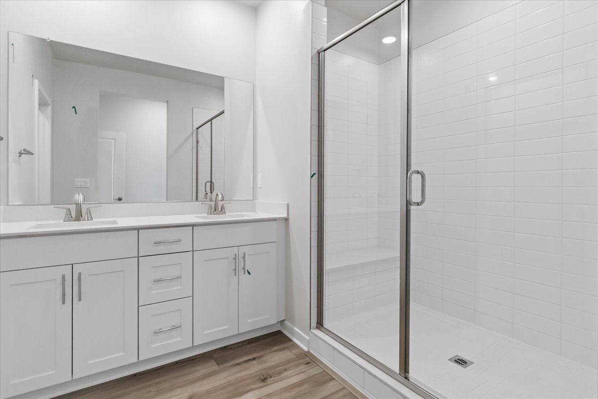 A bathroom with a glass shower.