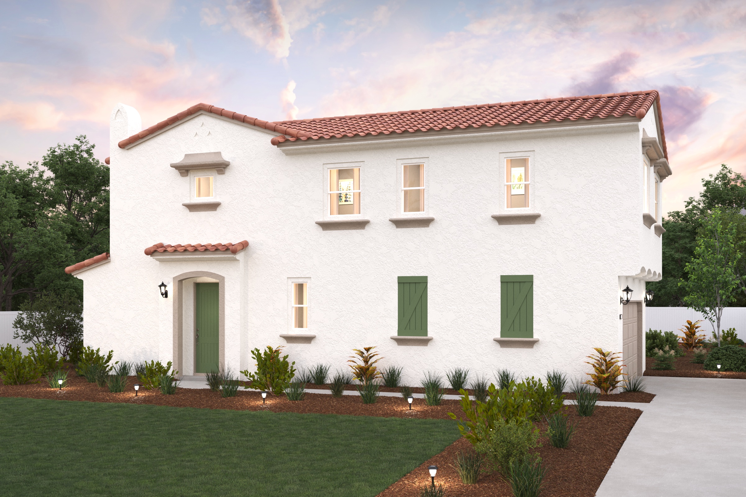 A white house with green trim with Adamson House in the background.