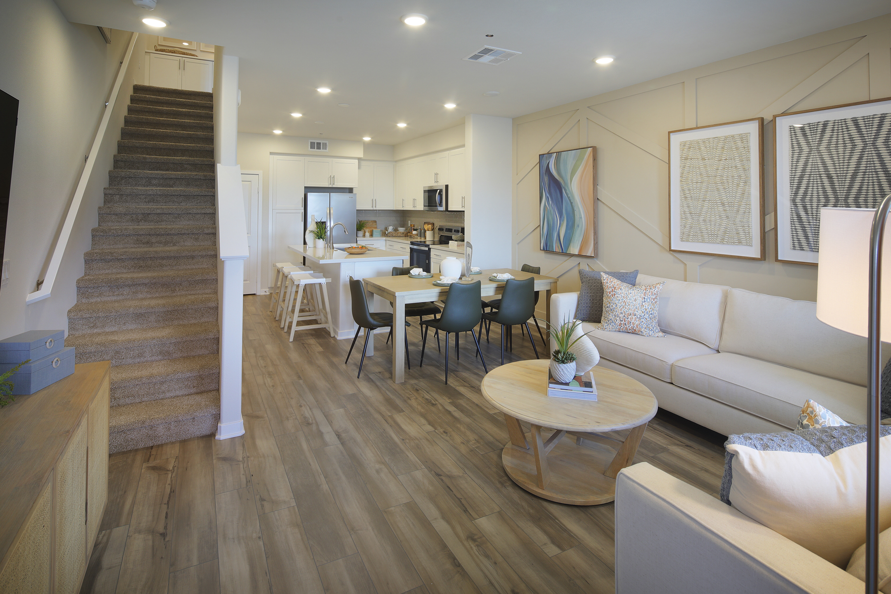 A living room with a wood floor.