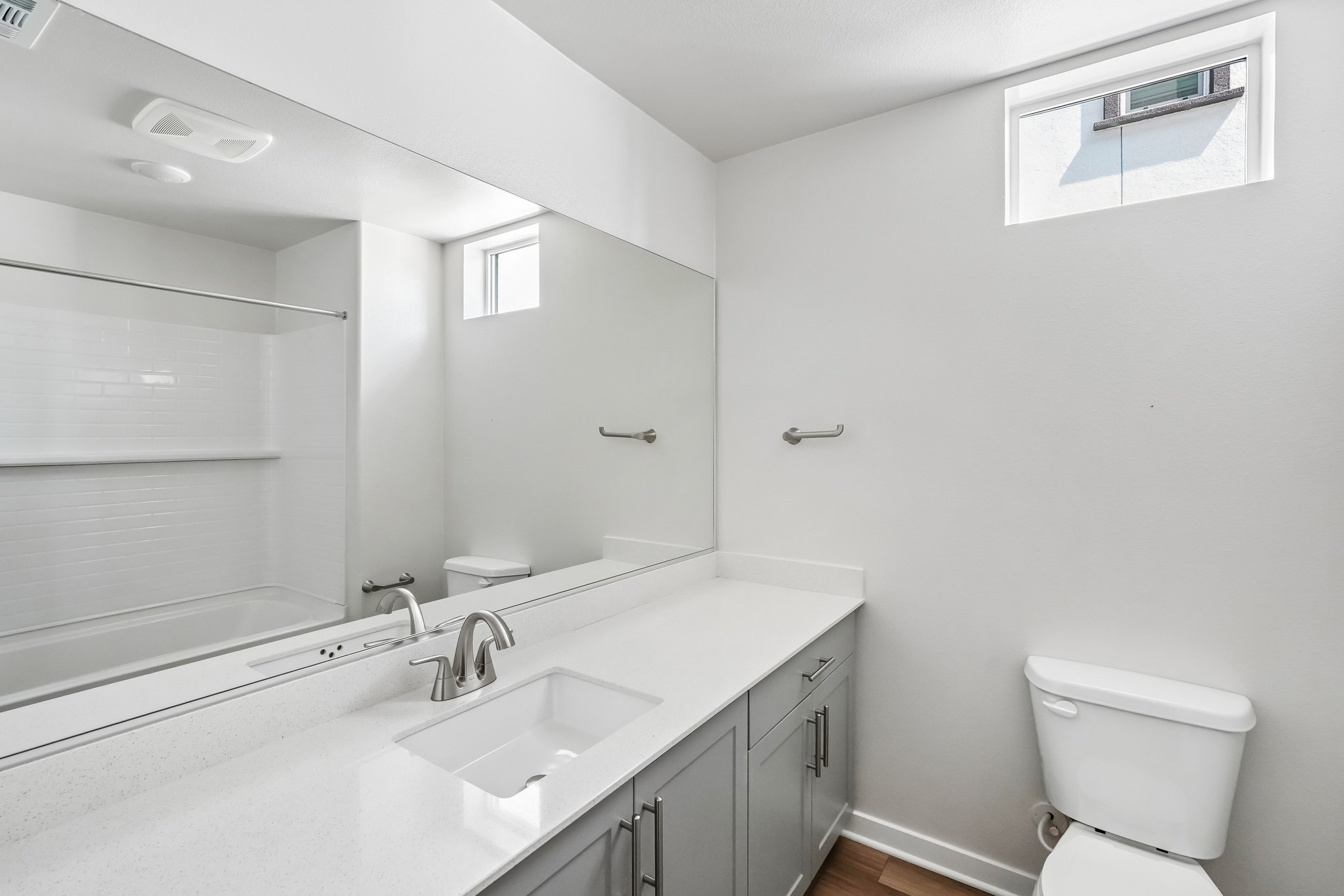 A bathroom with a sink and a toilet.