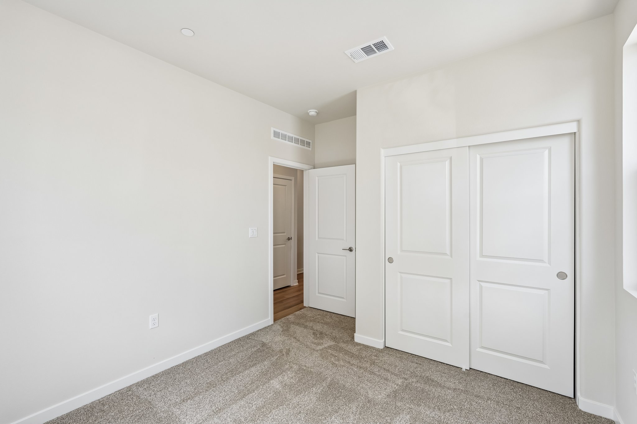 A room with white doors.