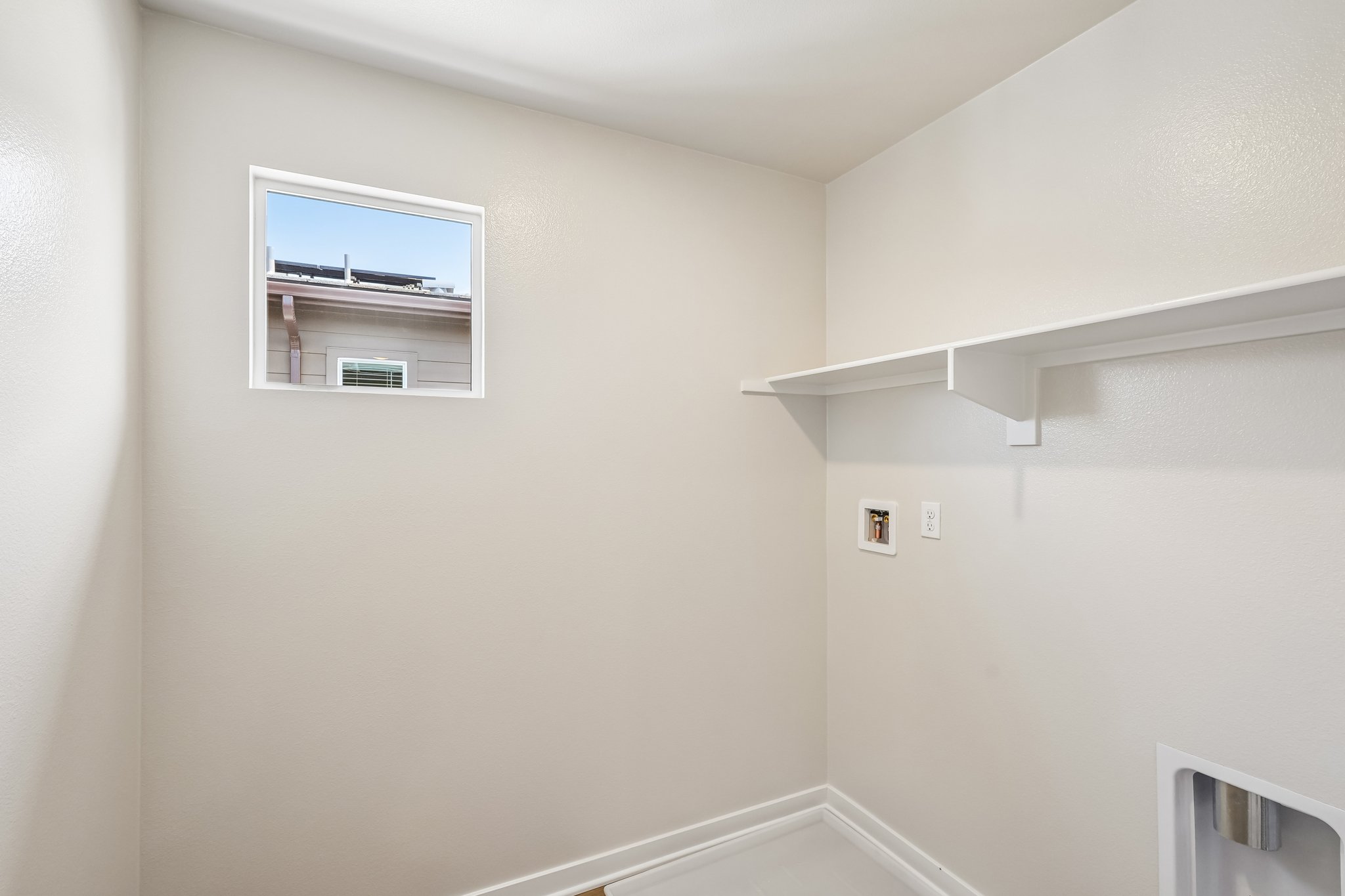 A white room with a white wall.