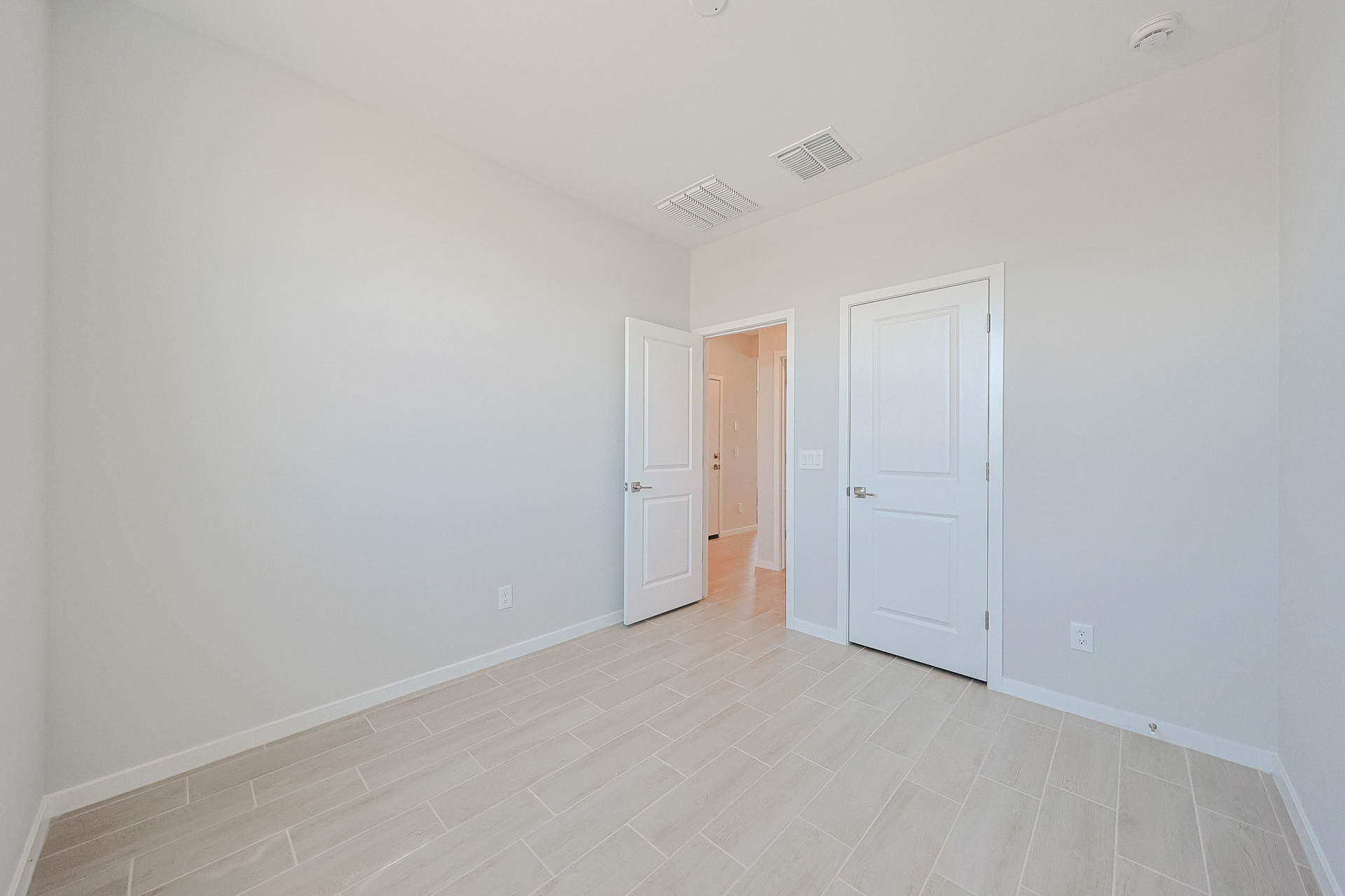 A room with white doors.