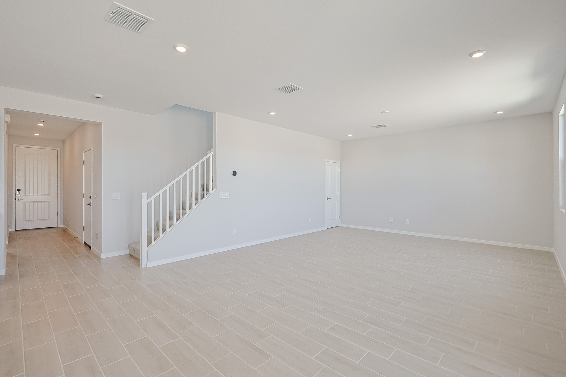 A long hallway with white walls.