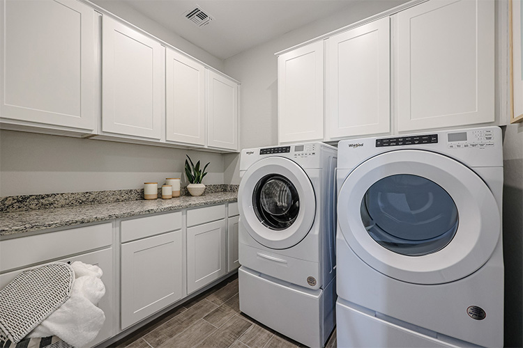 A washing machine in a kitchen.