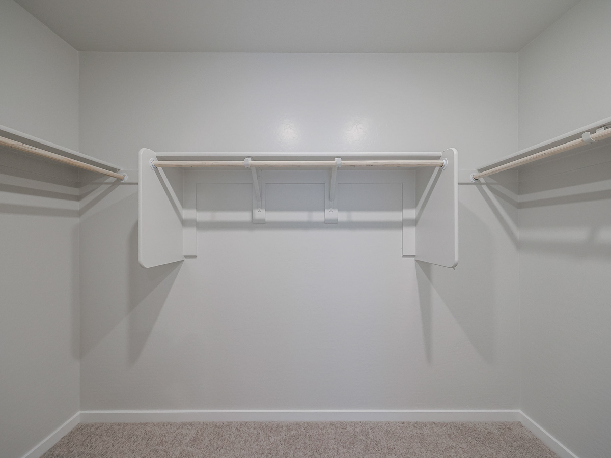 A white staircase in a room.