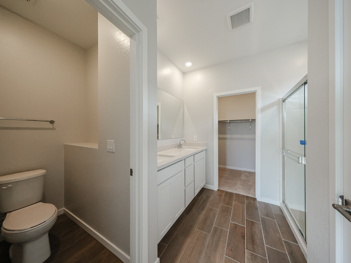 A bathroom with a toilet and sink.
