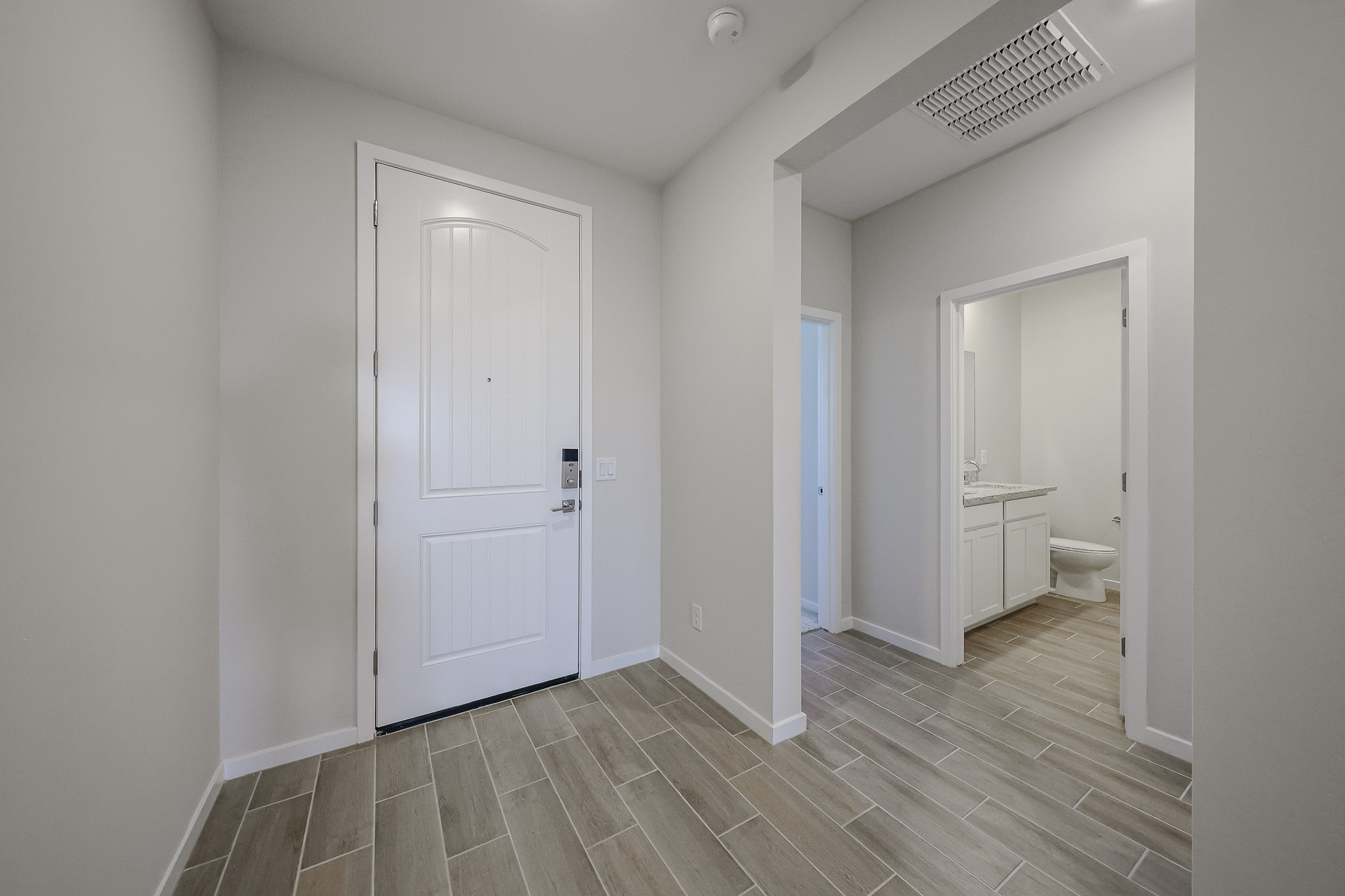 A bathroom with white walls.