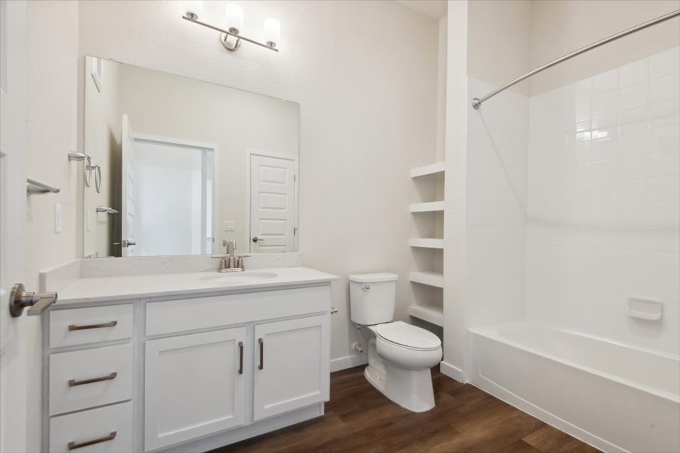 A bathroom with a toilet and sink.