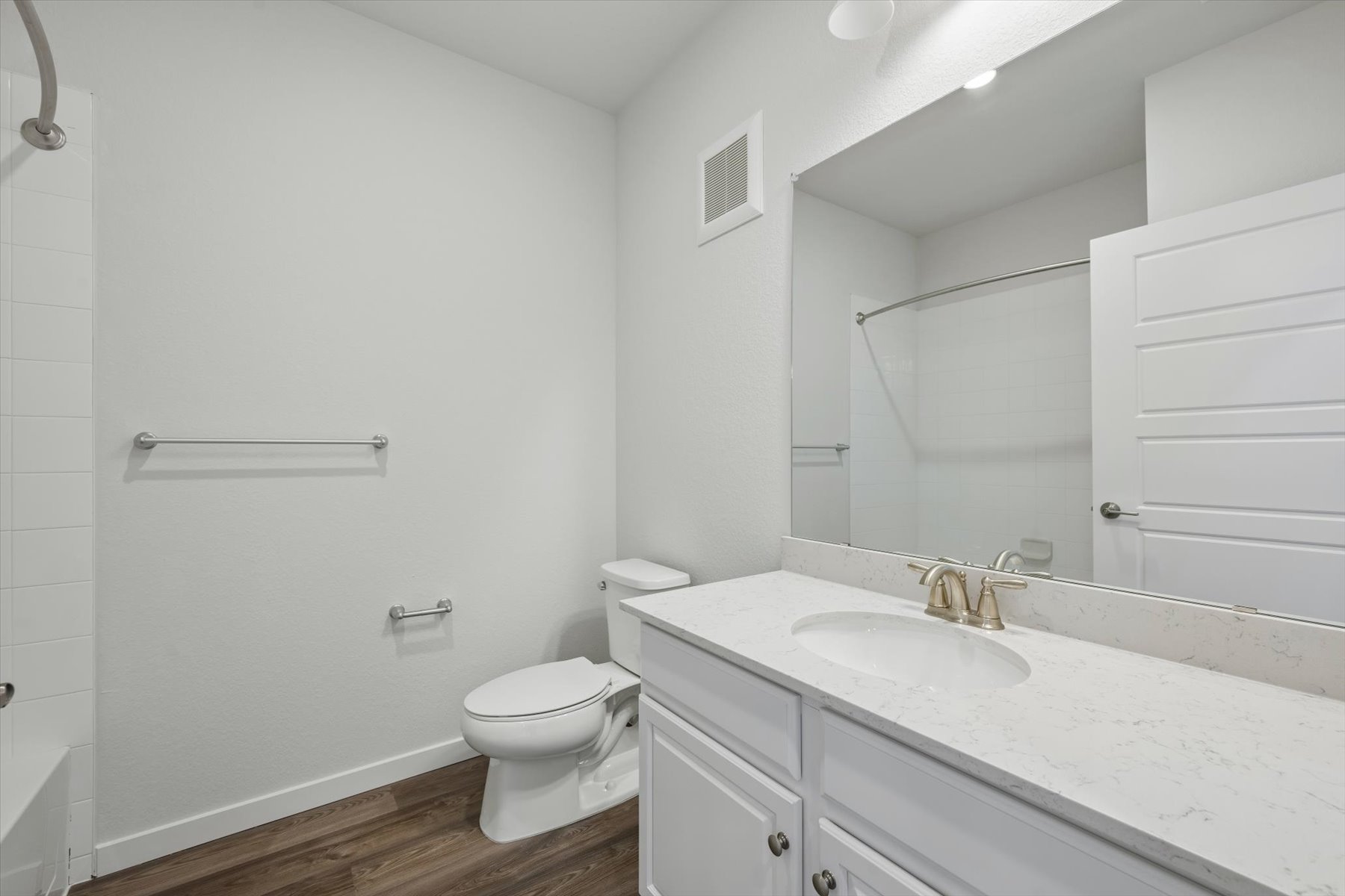 A bathroom with a sink toilet and shower.