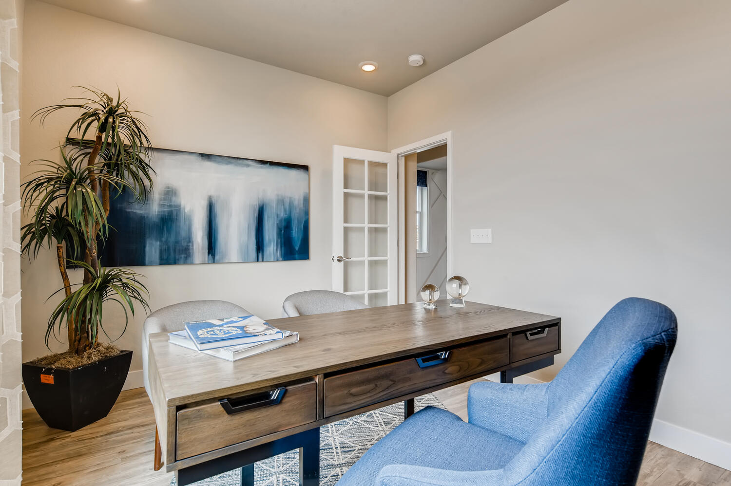 A room with a table and chairs.