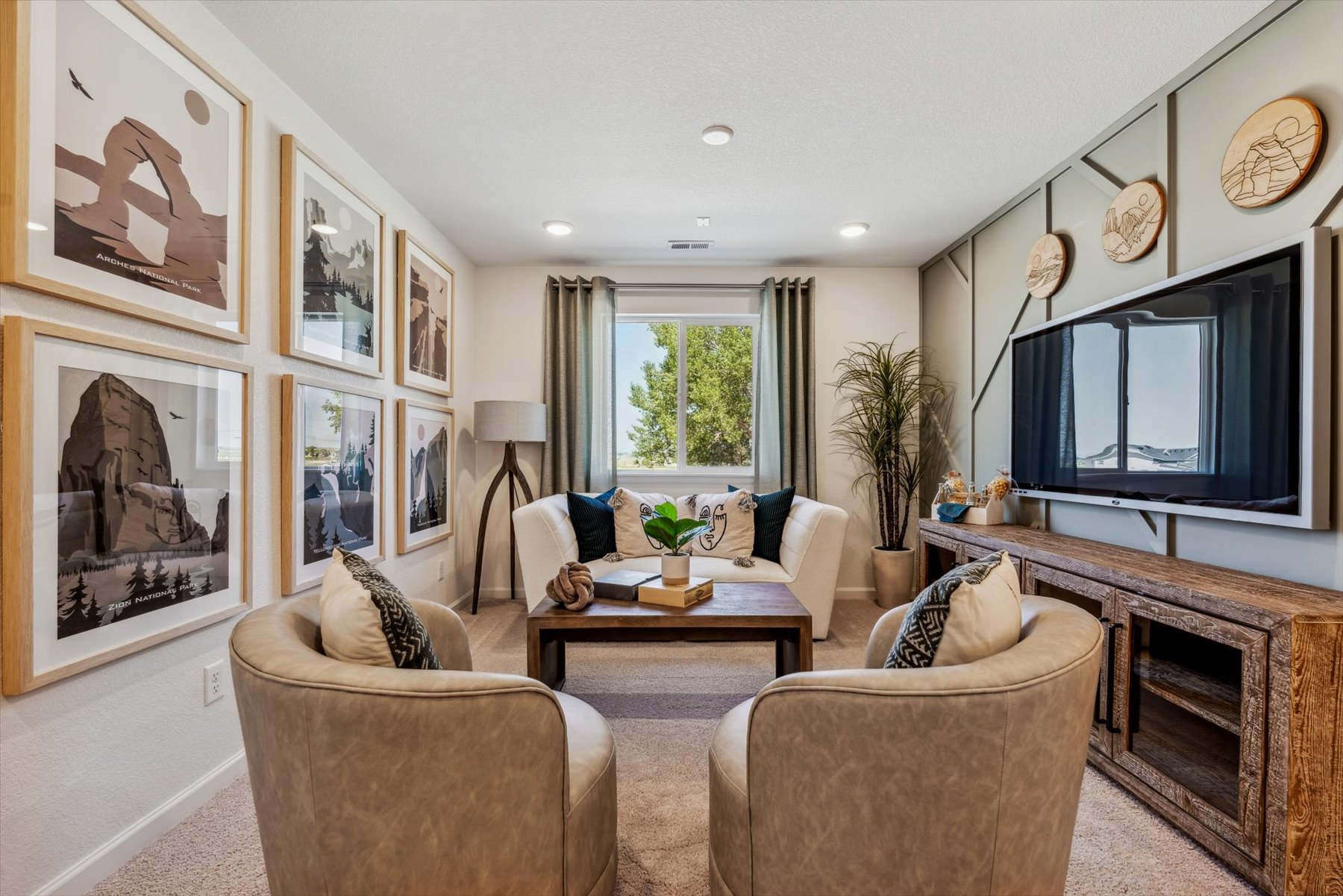 A living room with a tv and couches.