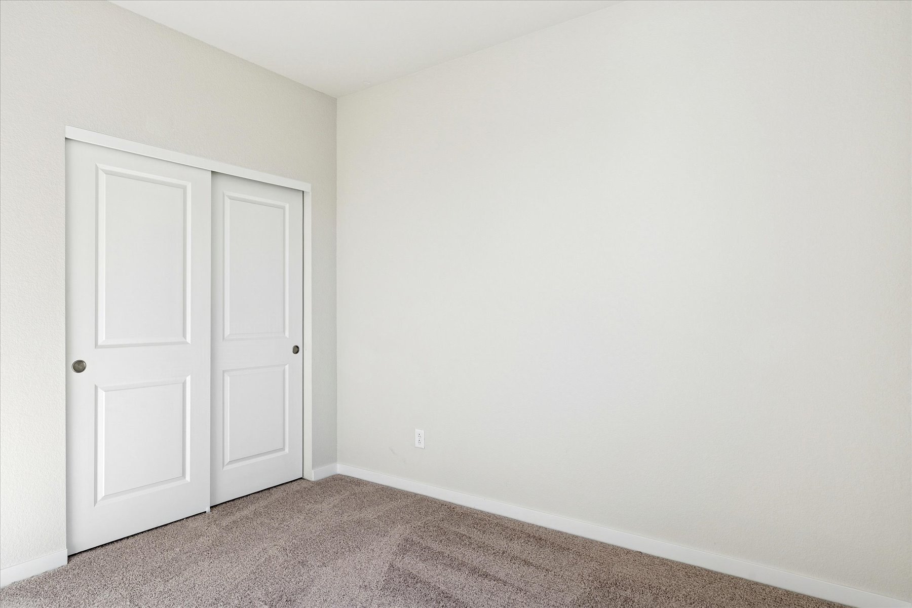 A room with white doors.