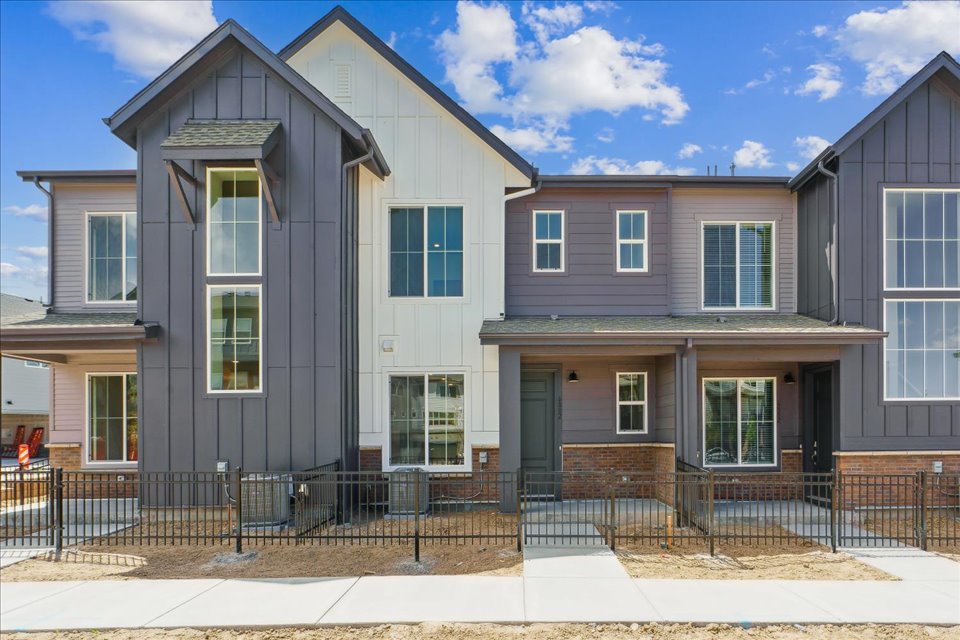 A building with a fence in front.