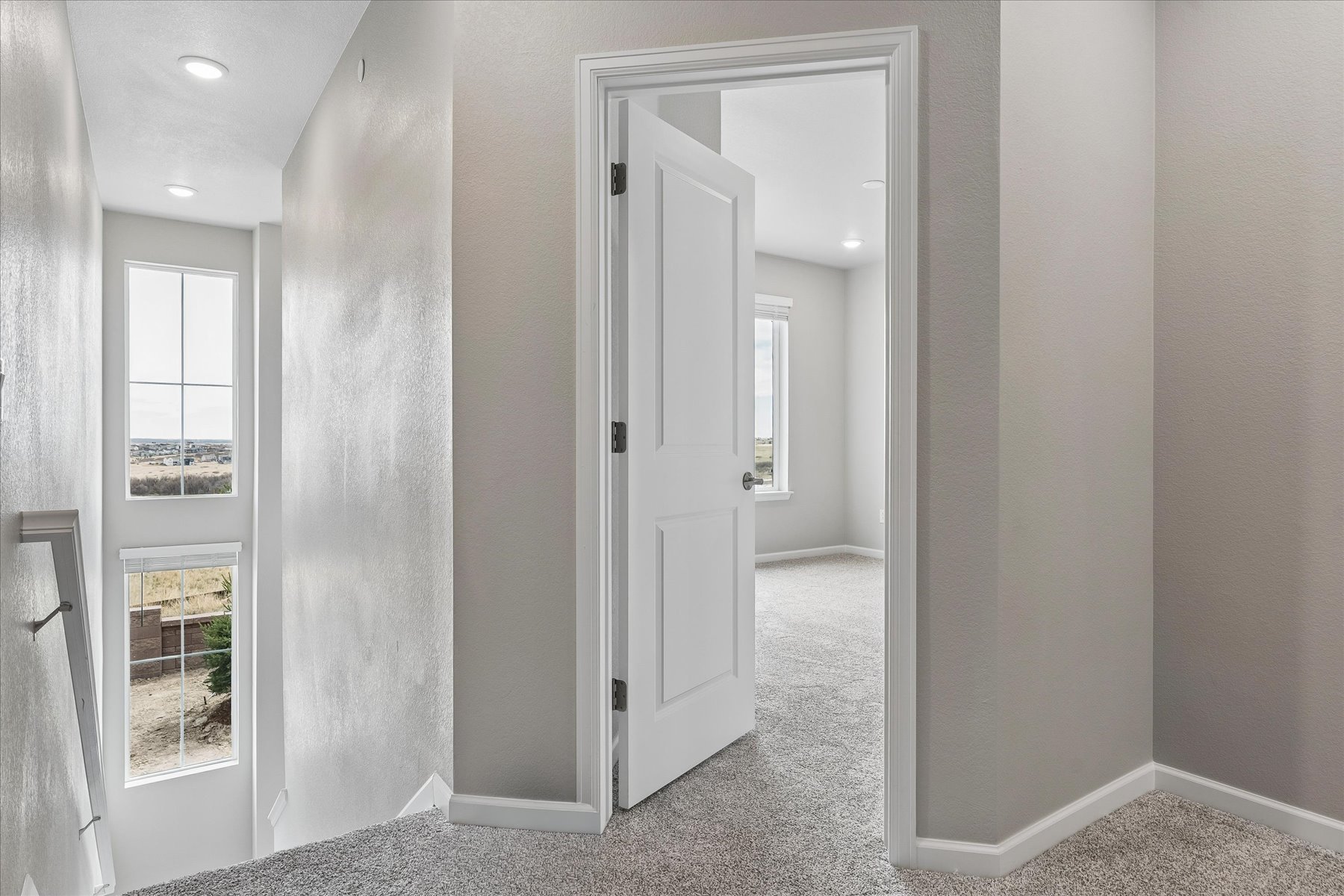 A room with a door and a window.