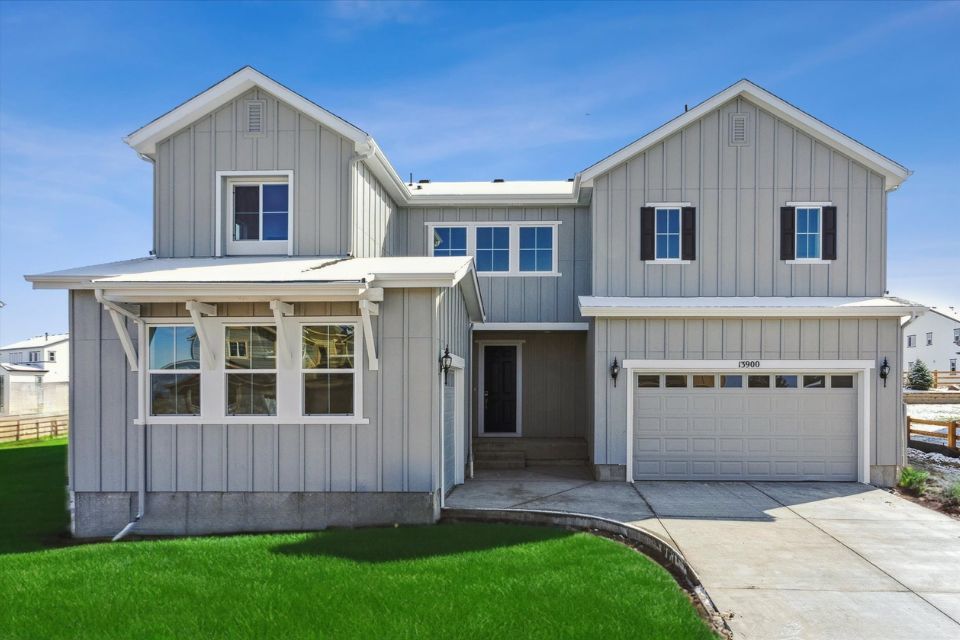 A white house with a garage.