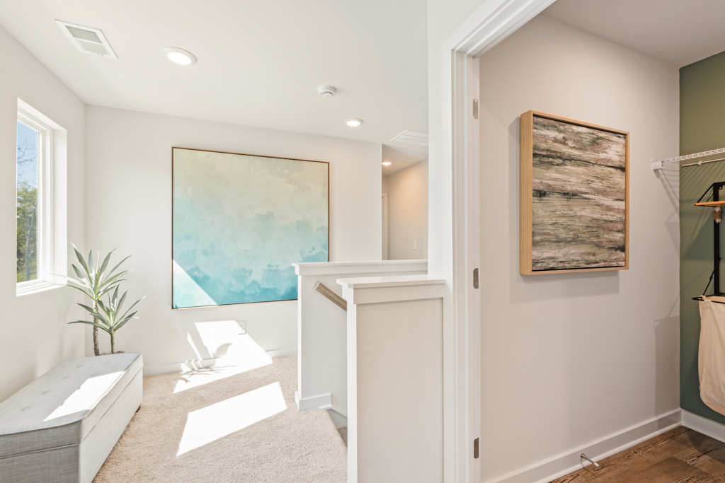 A room with a painting on the wall.