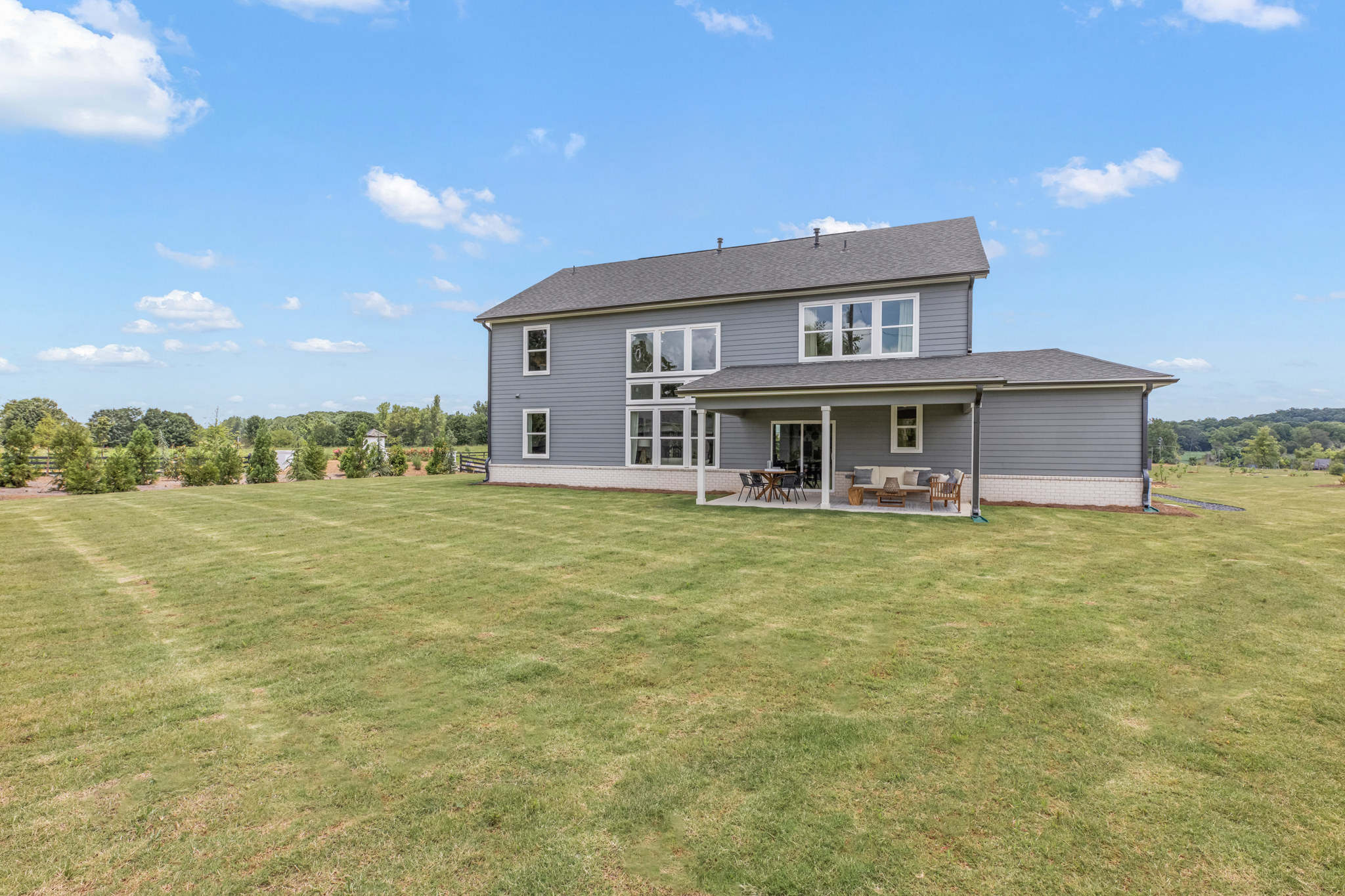 A house with a lawn in front.