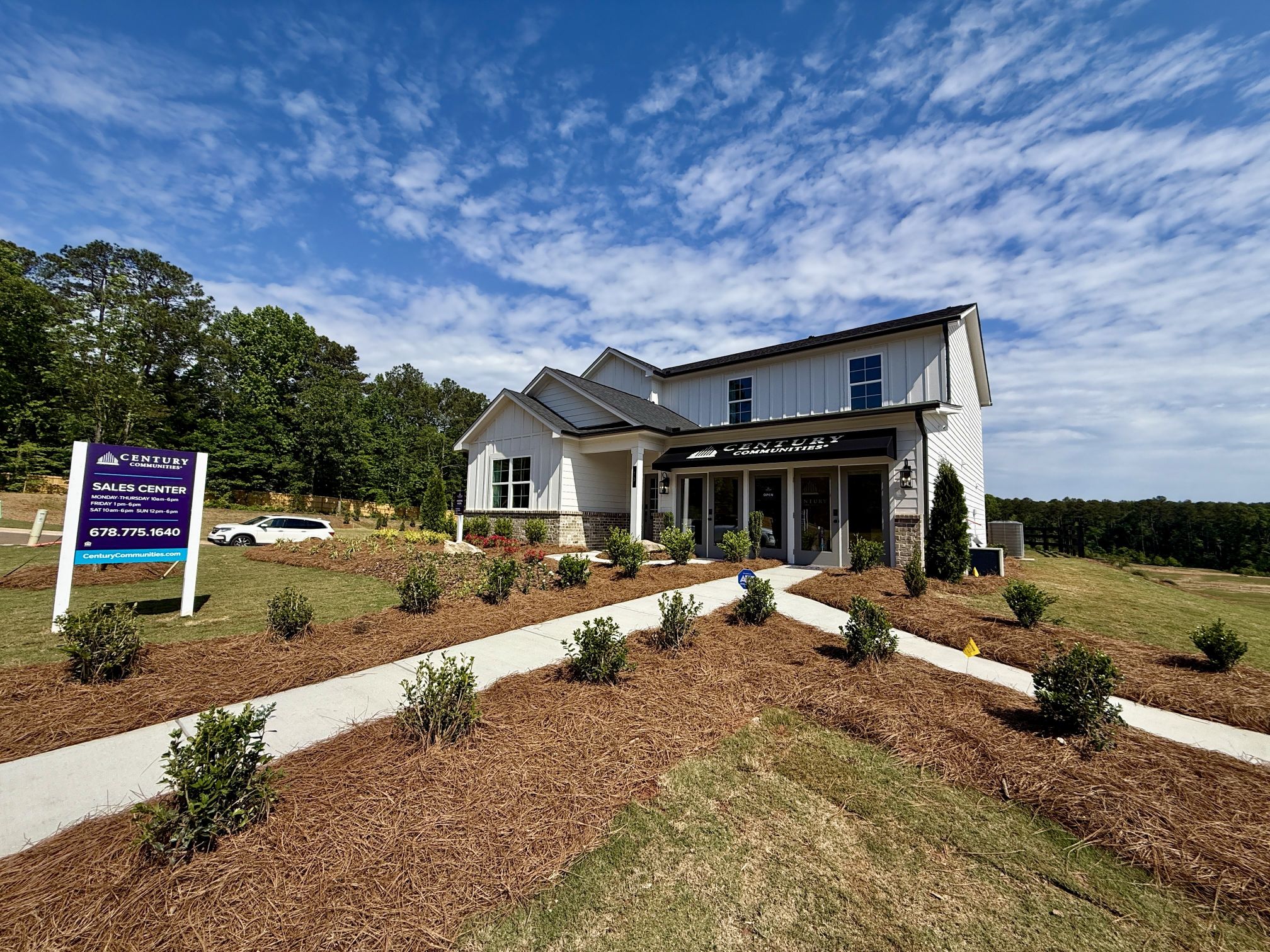 A house with a sign in front.