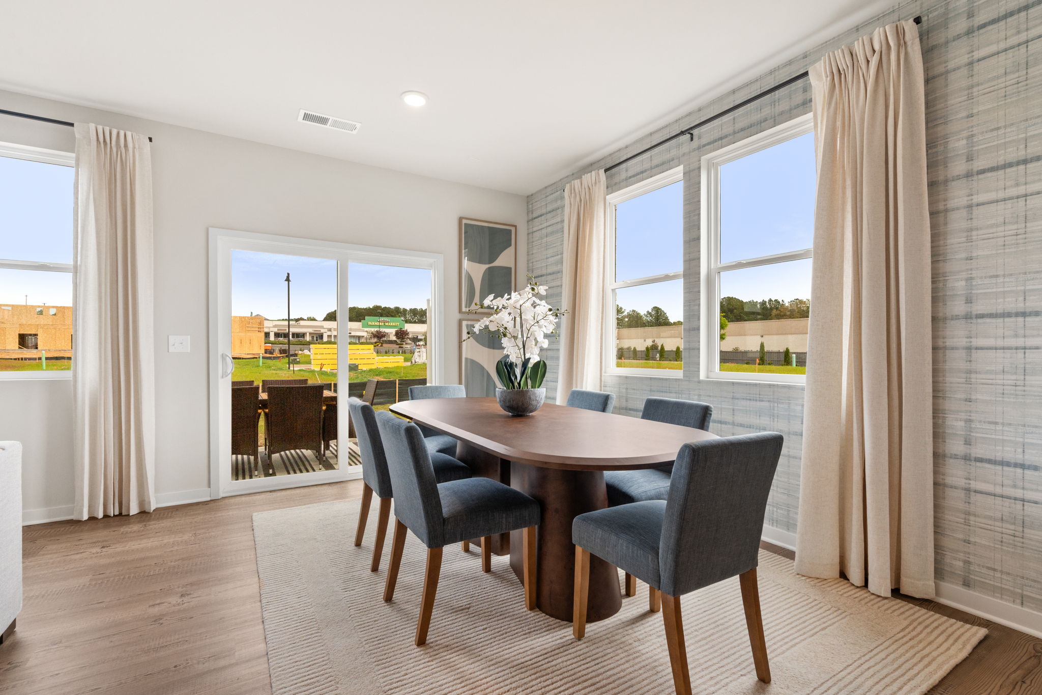 A dining room with a large window.