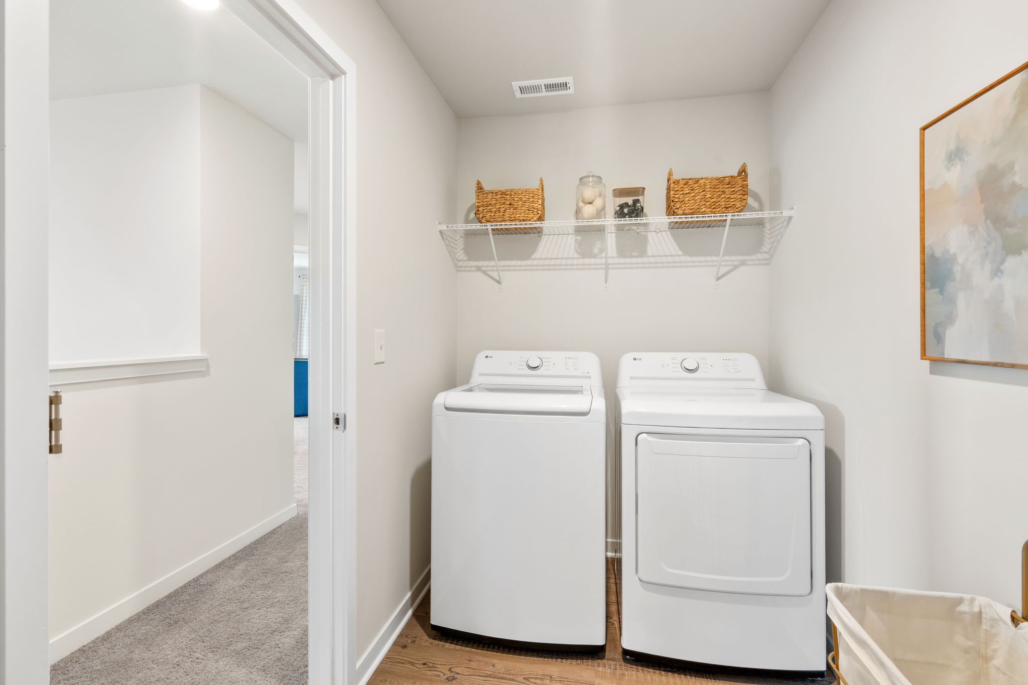 A laundry room with a washer and dryer.