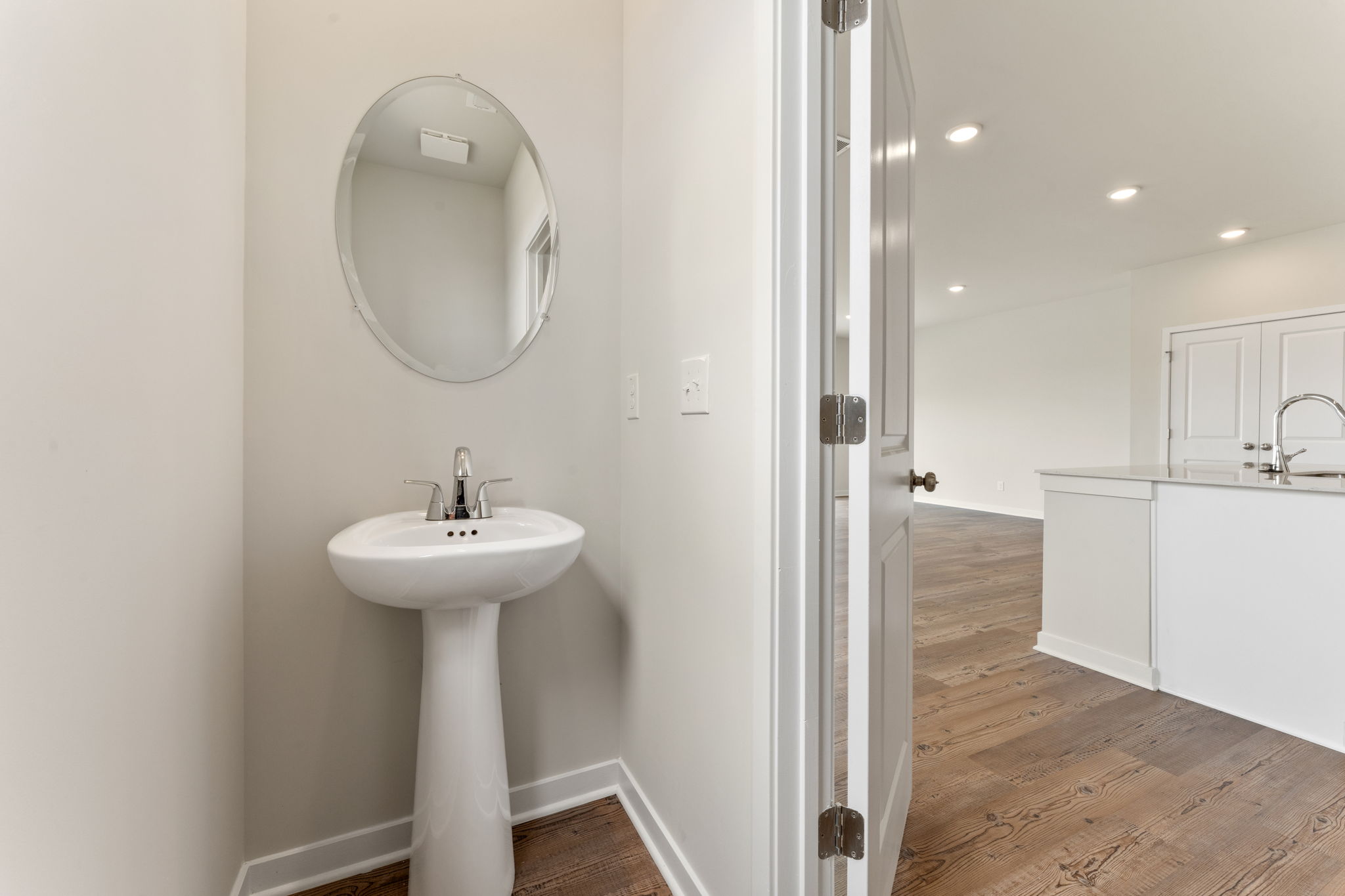 A bathroom with a sink and a mirror.