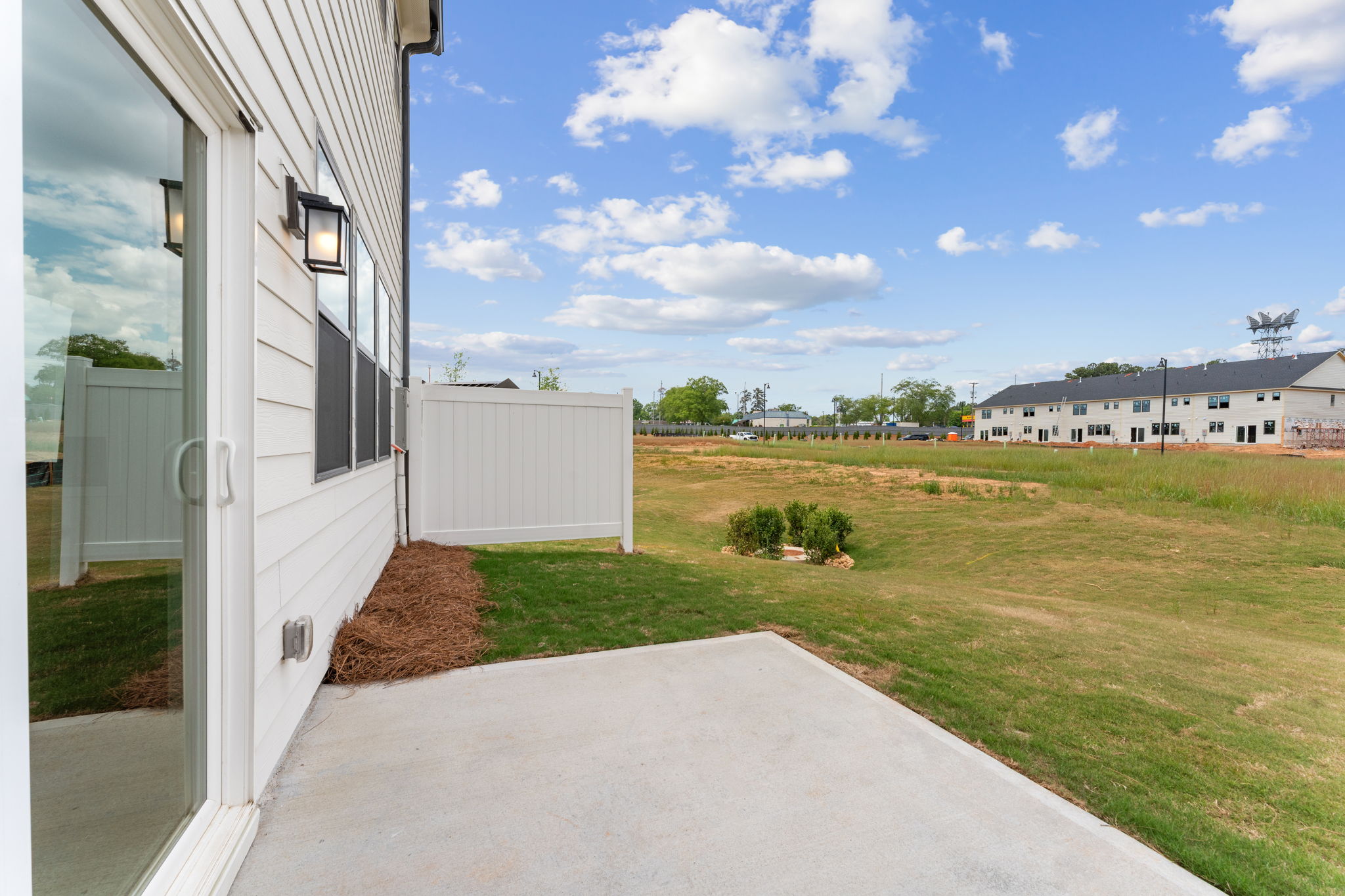 A building with a grass yard.