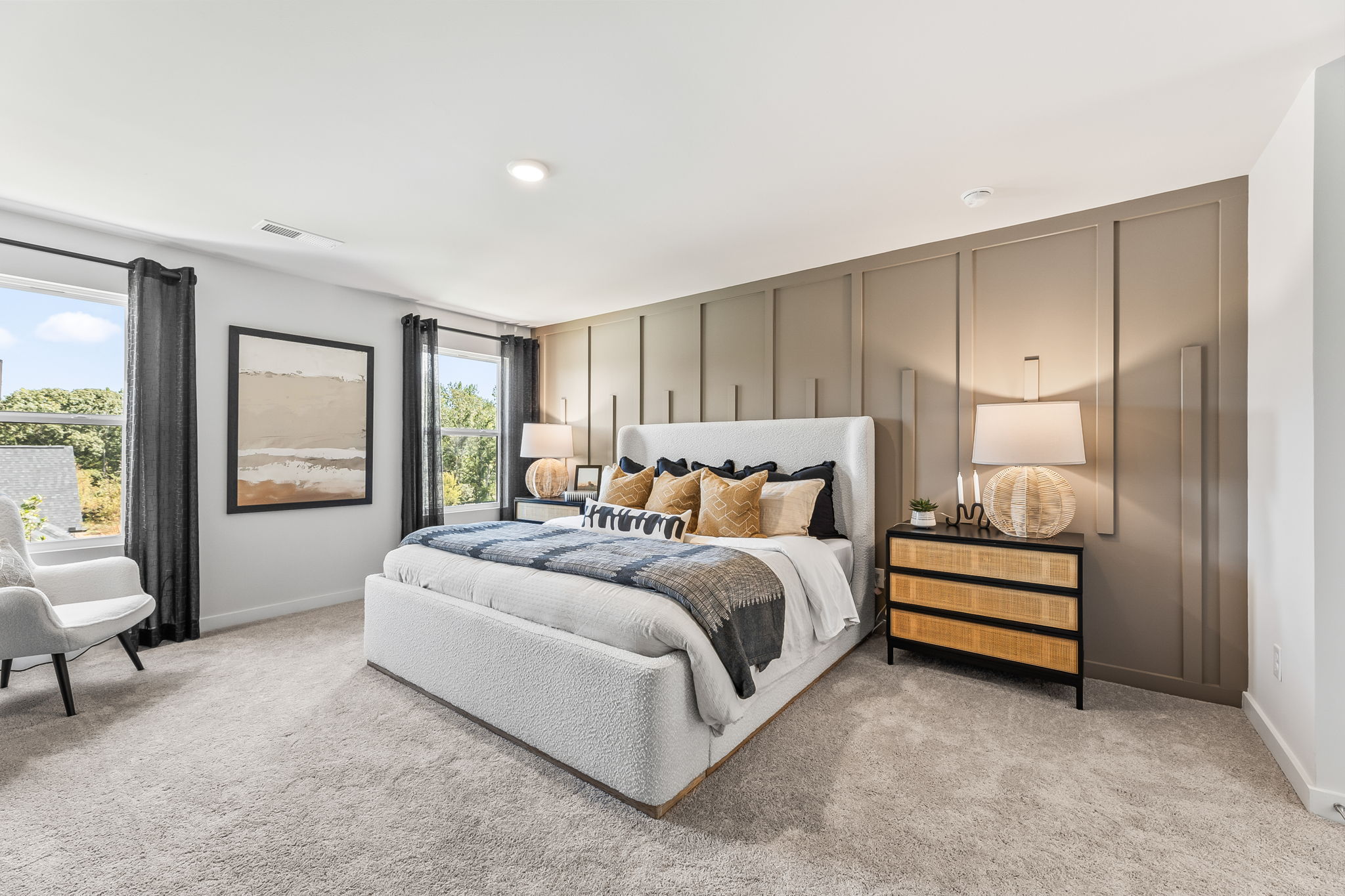 A bedroom with a large bed.