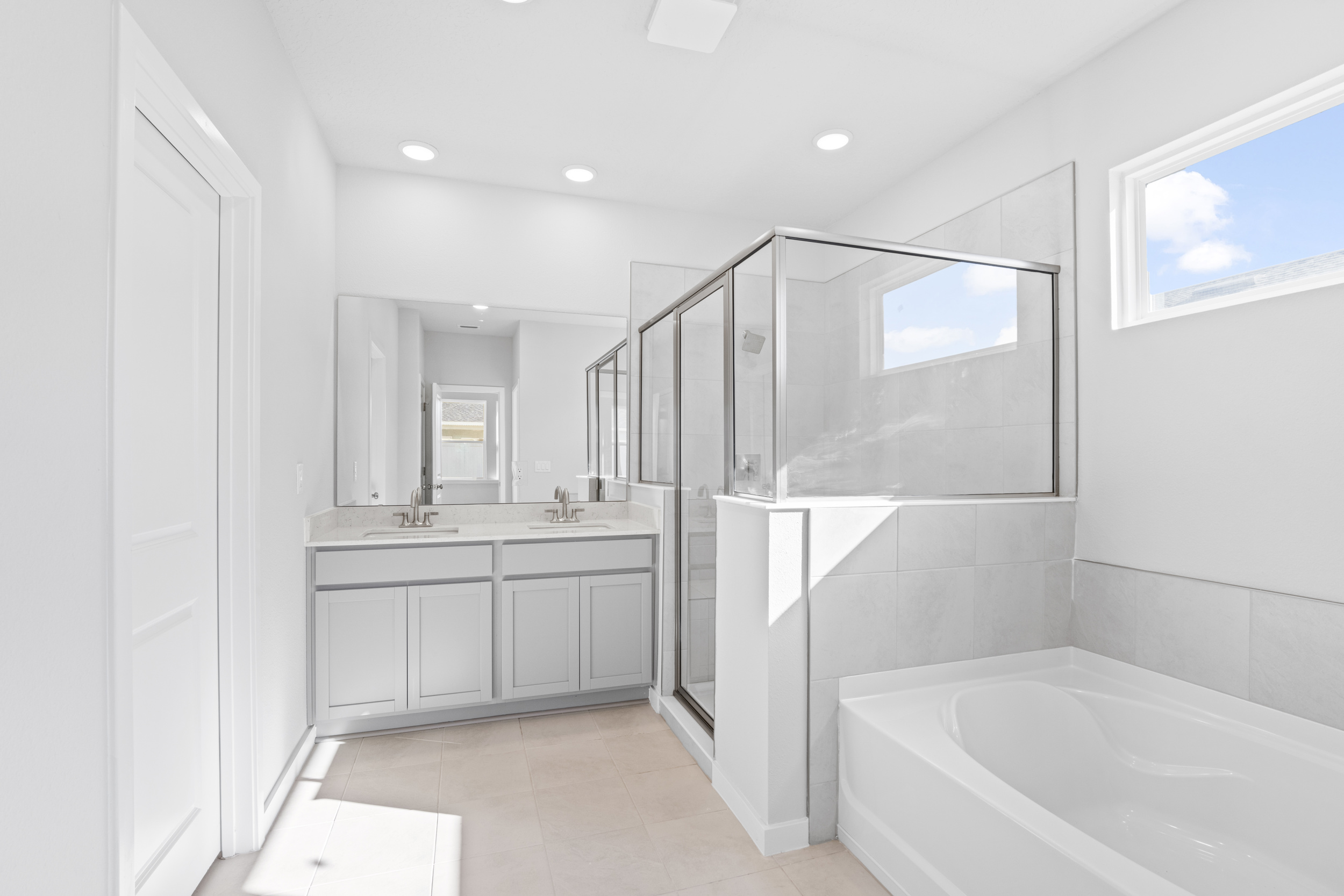 Lot 23 Primary Bathroom with Bathtub and Walk-In Shower at Camden Woods in Kingsland
