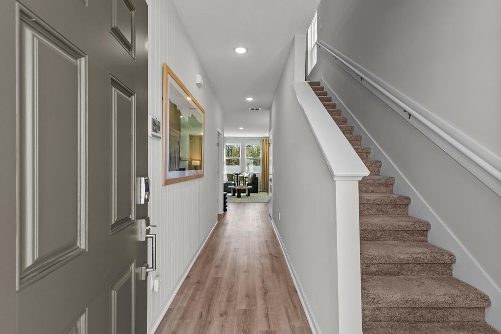 A hallway with white walls.