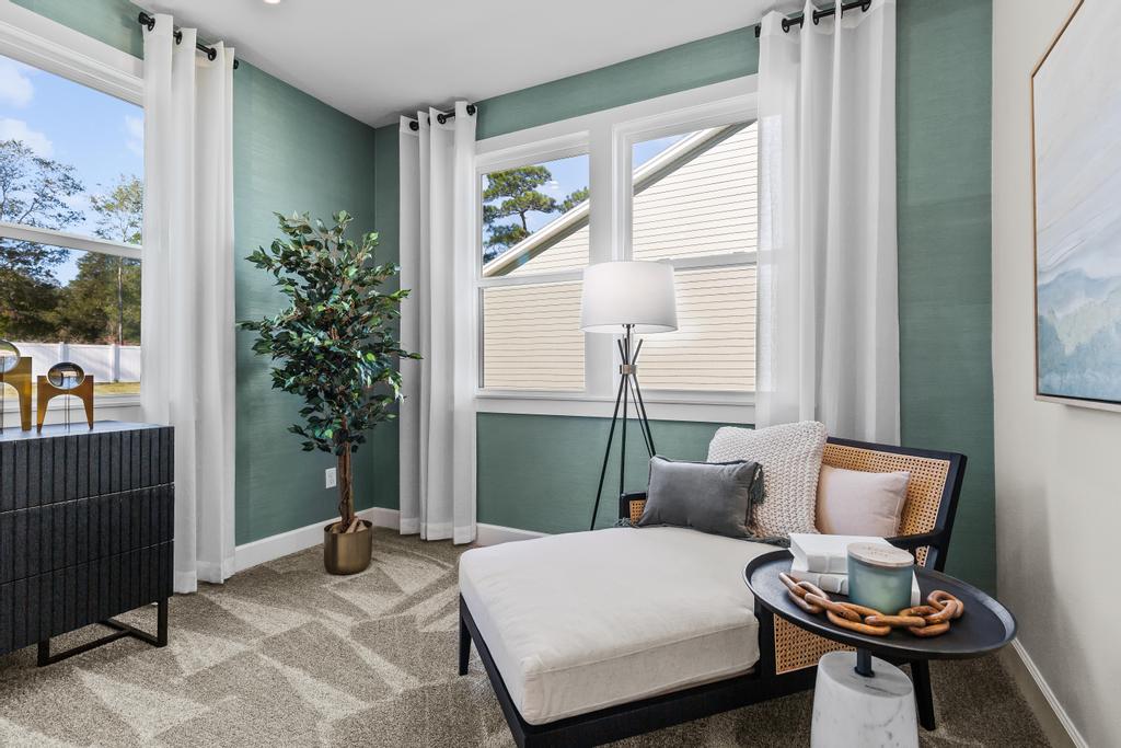 A living room with a couch and a table.