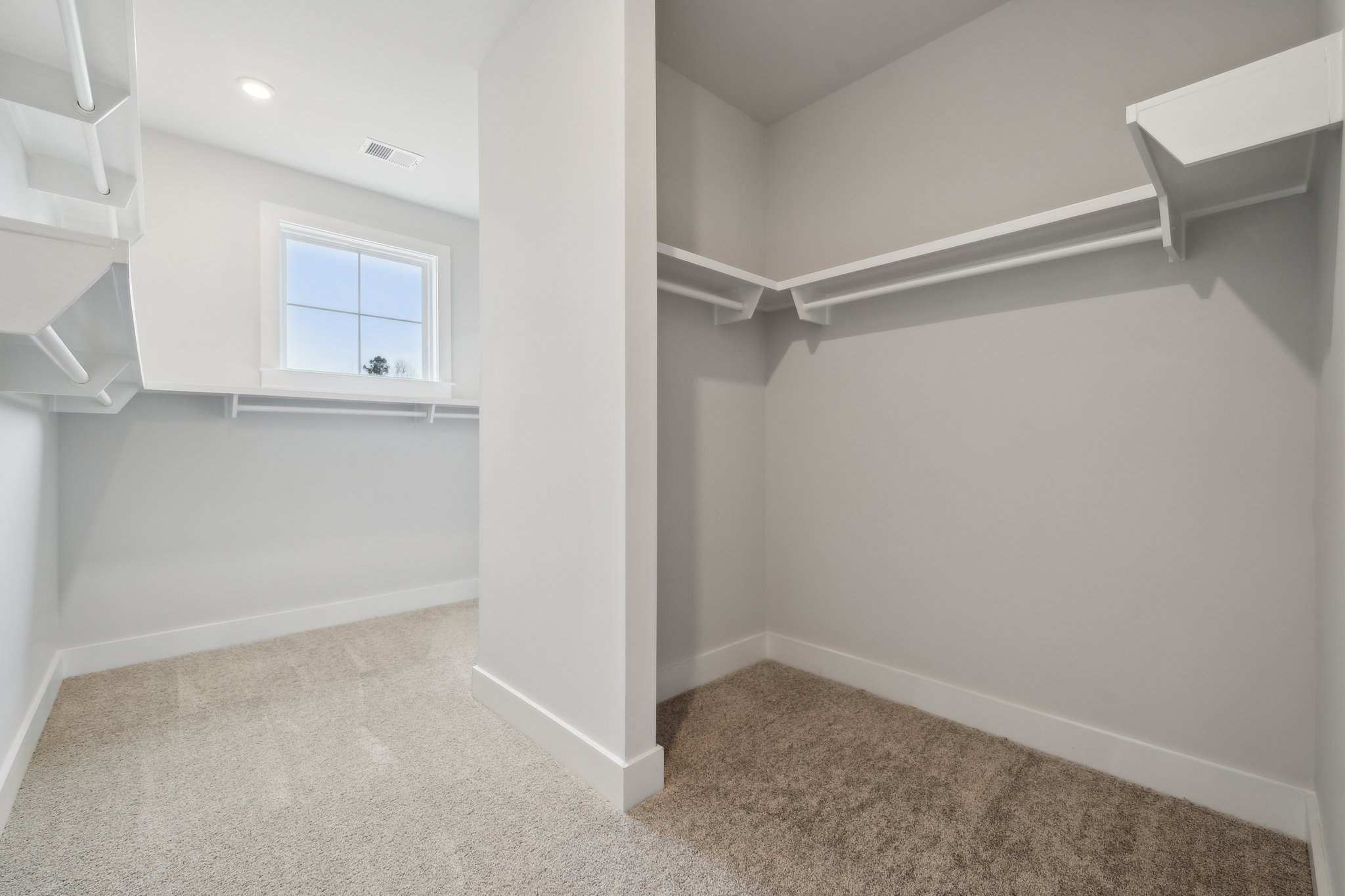 A white room with a window.