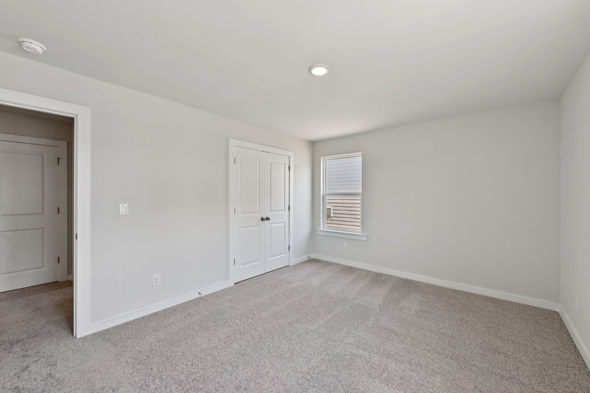 A room with white doors.