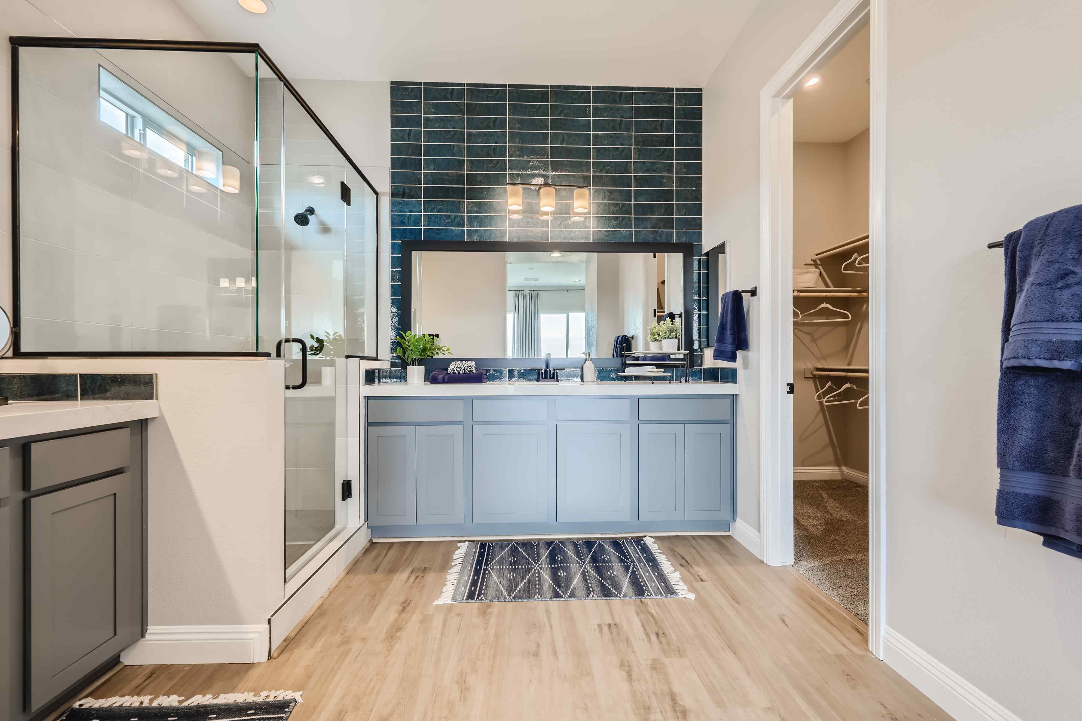A modern looking bathroom with a large glass door.