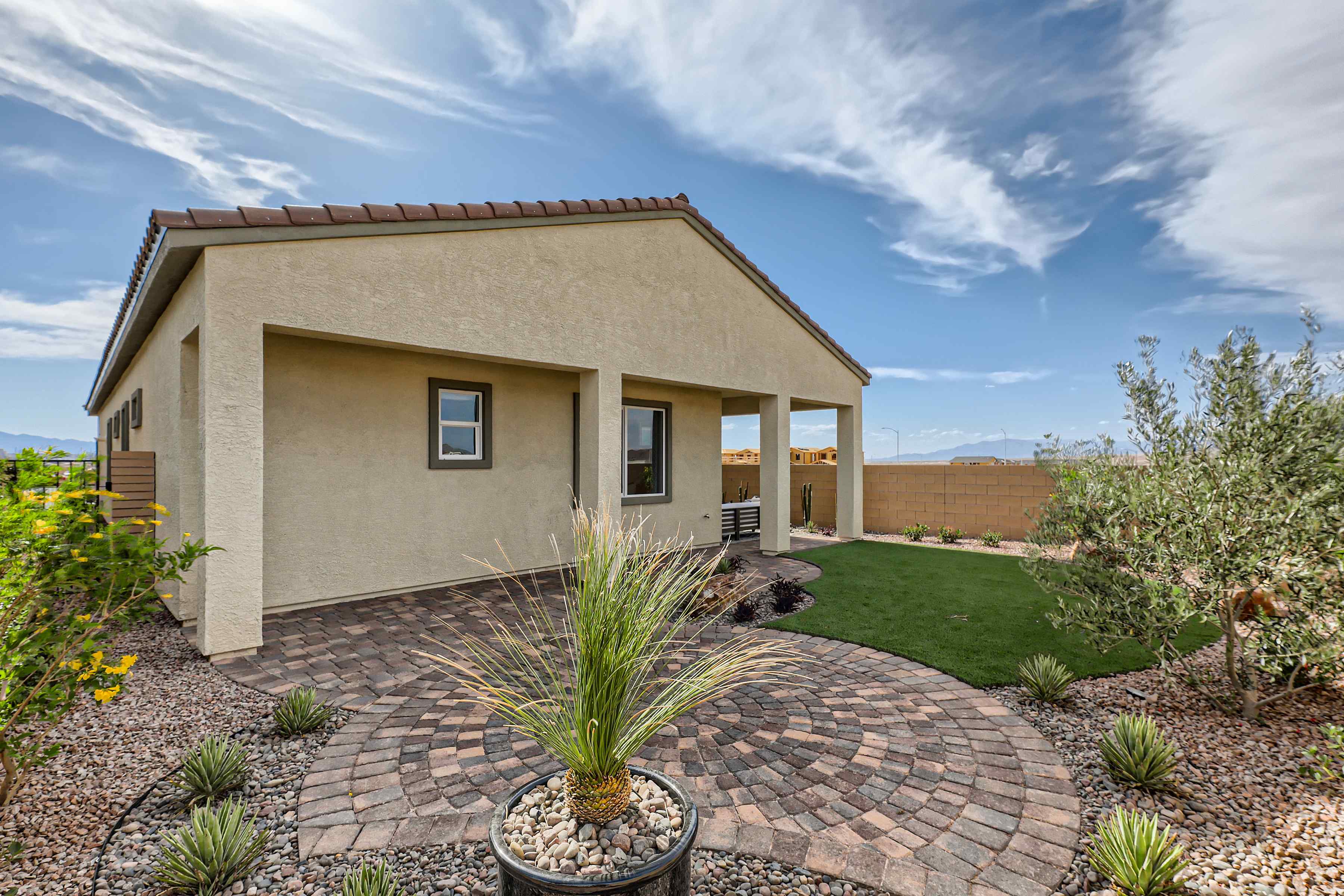 A house with a brick driveway.
