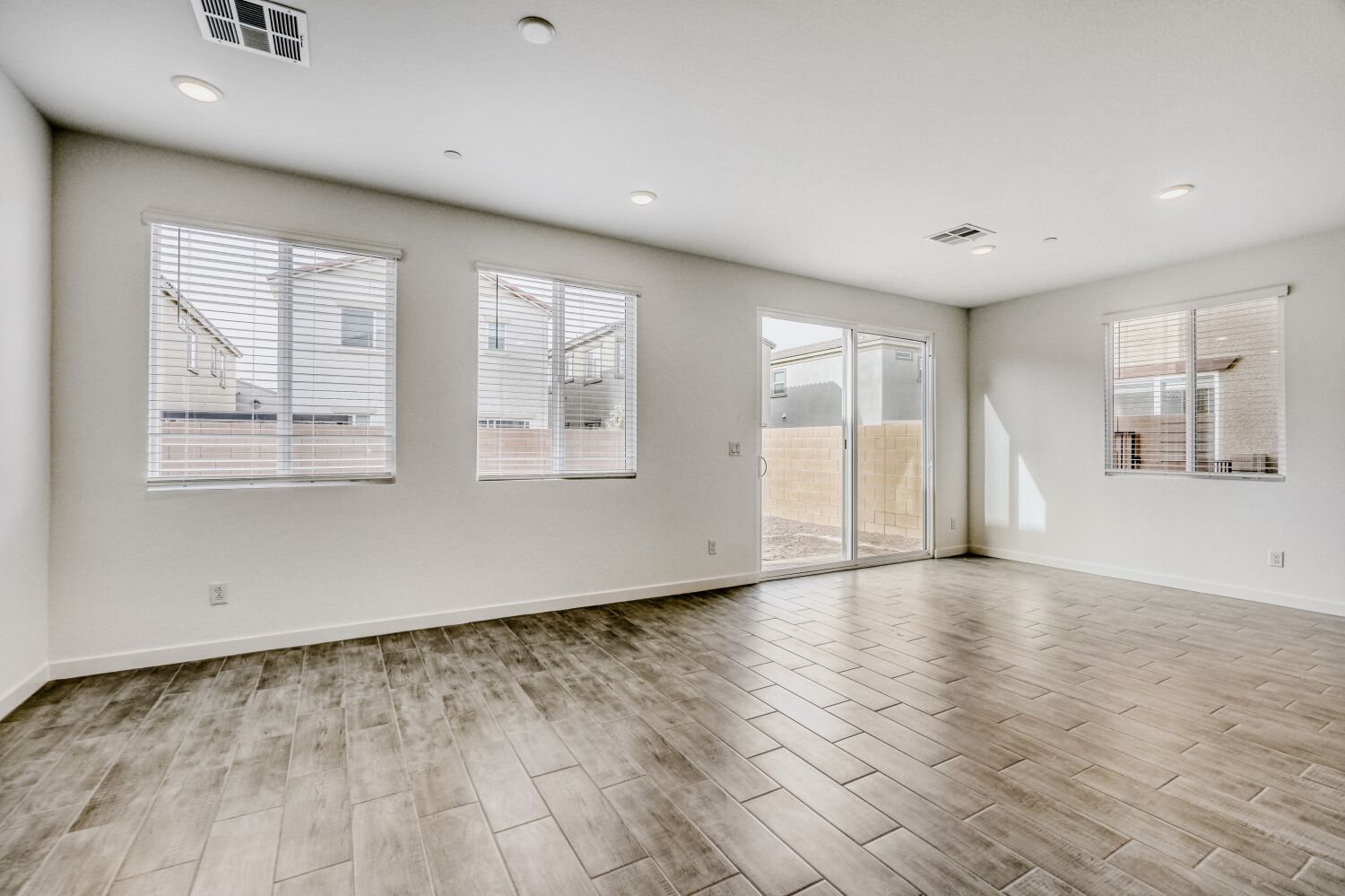 A room with white walls and windows.