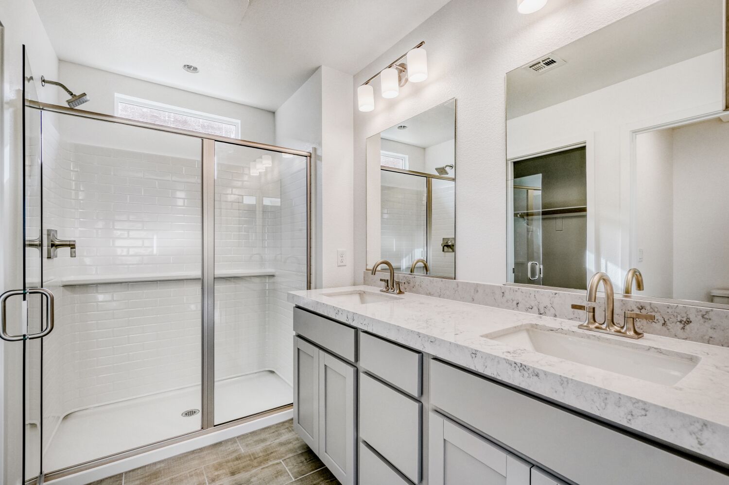 A bathroom with a glass shower.
