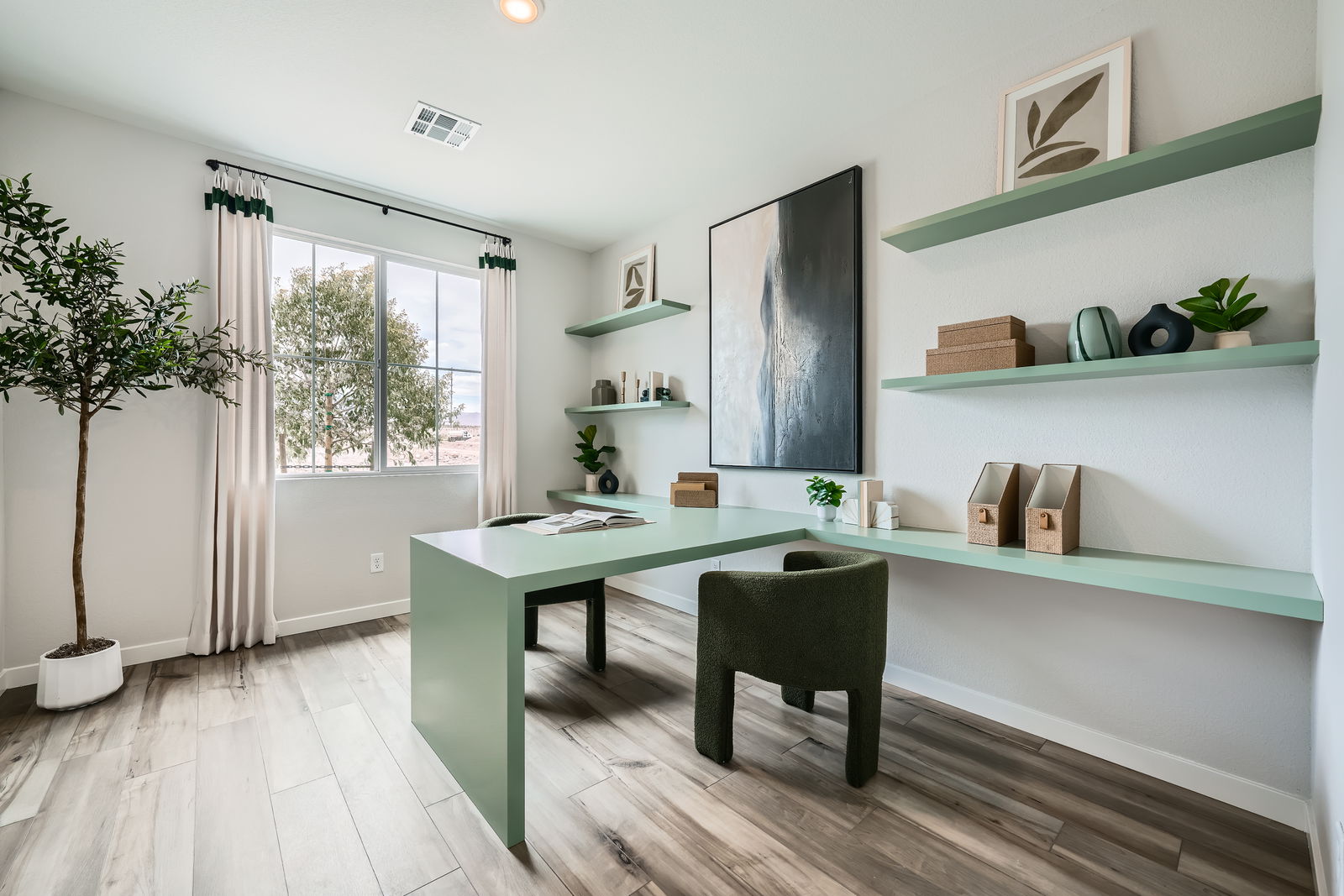 A room with a table and chairs.