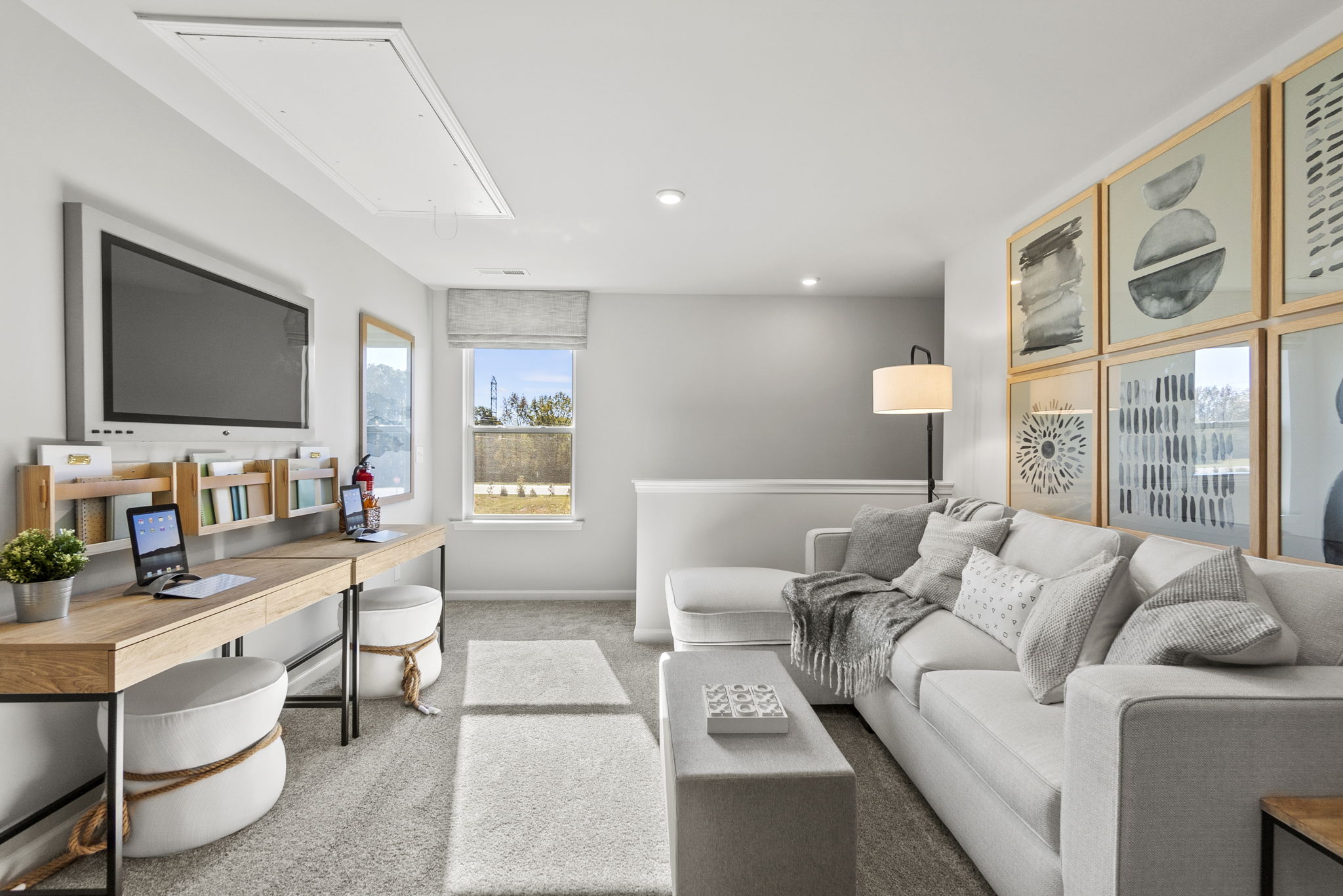 A living room with a large tv and a couch.