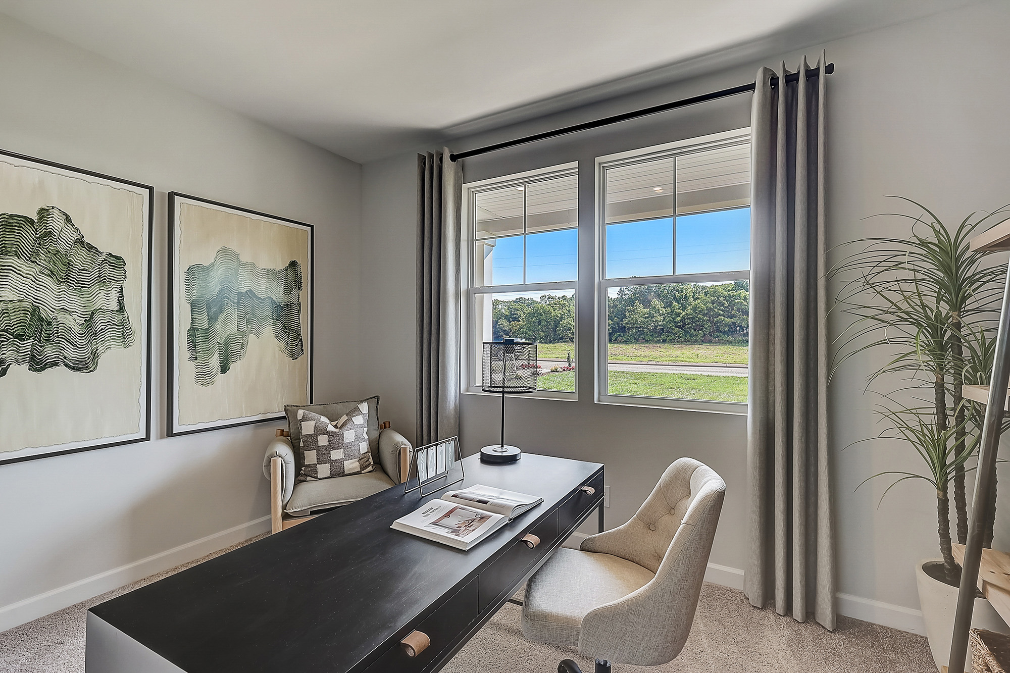 A bedroom with a large window.
