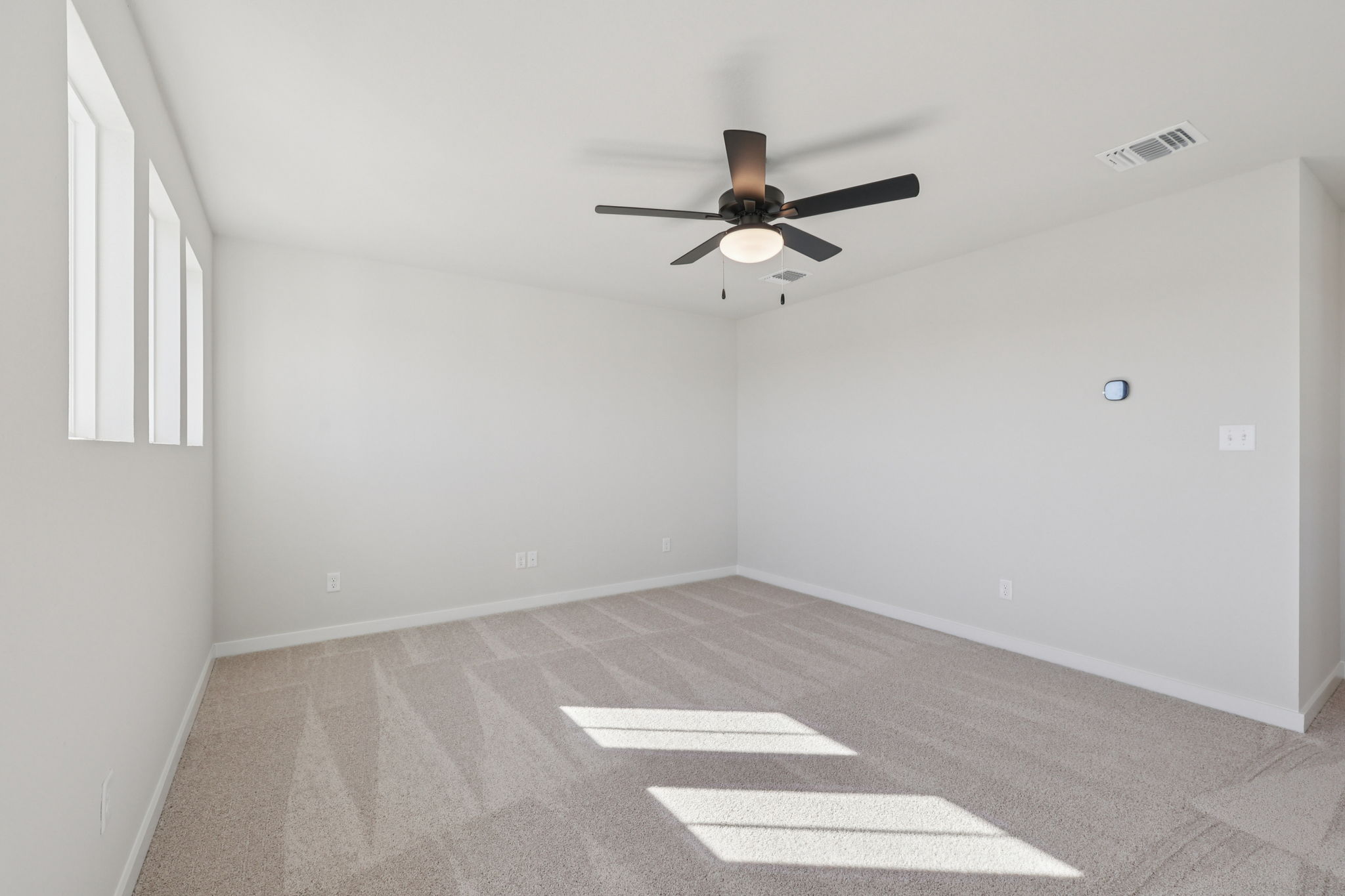 A ceiling fan in a room.