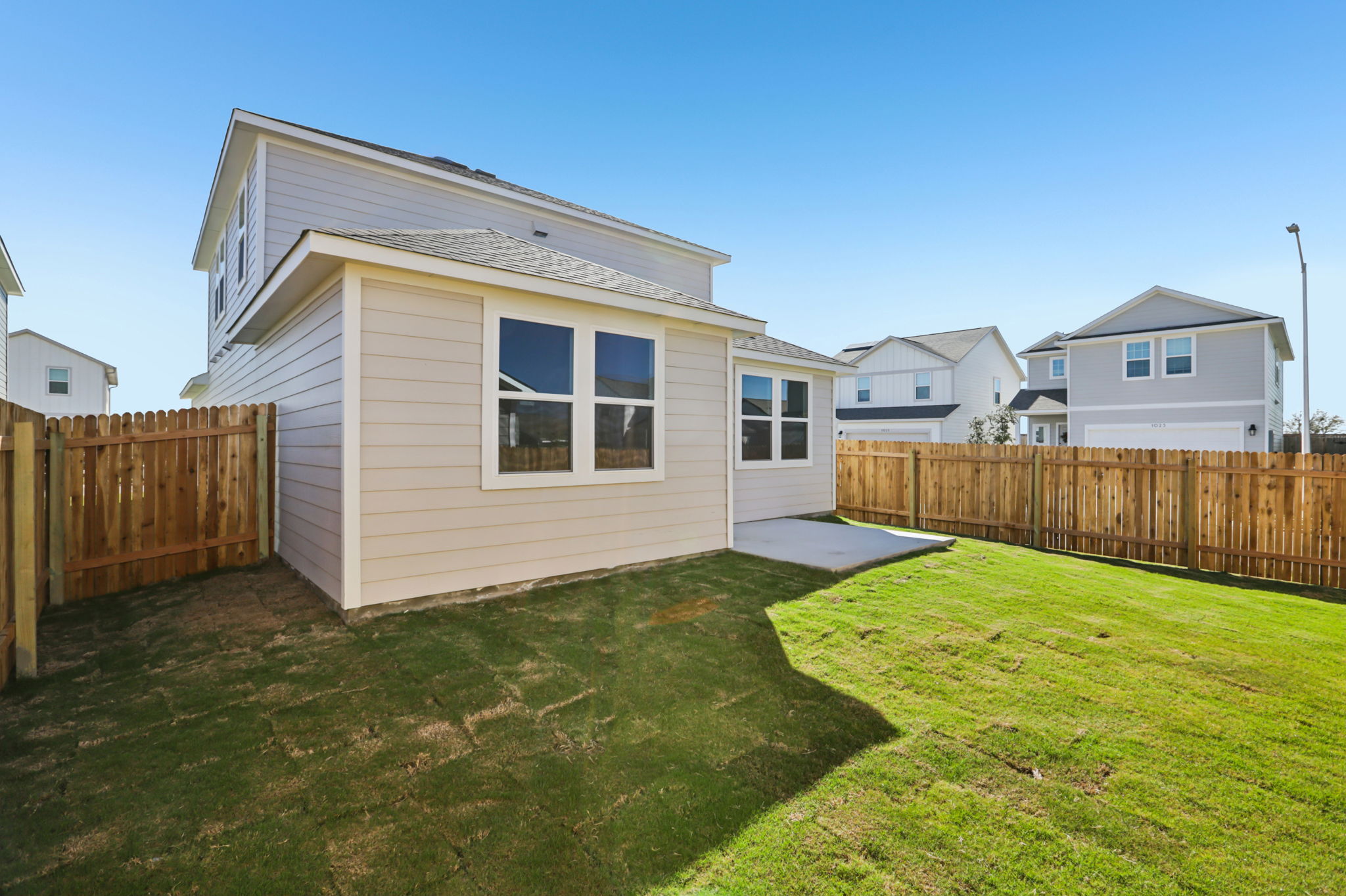 A small house with a fence.