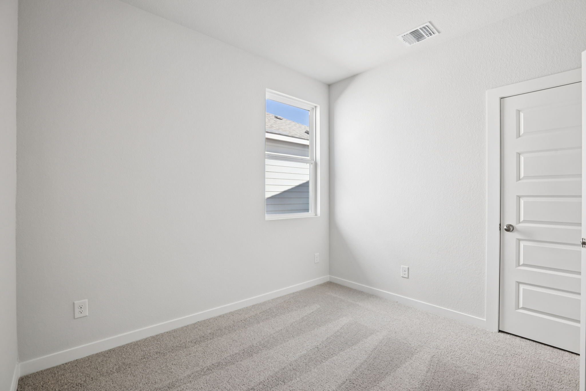 A room with a door and a window.