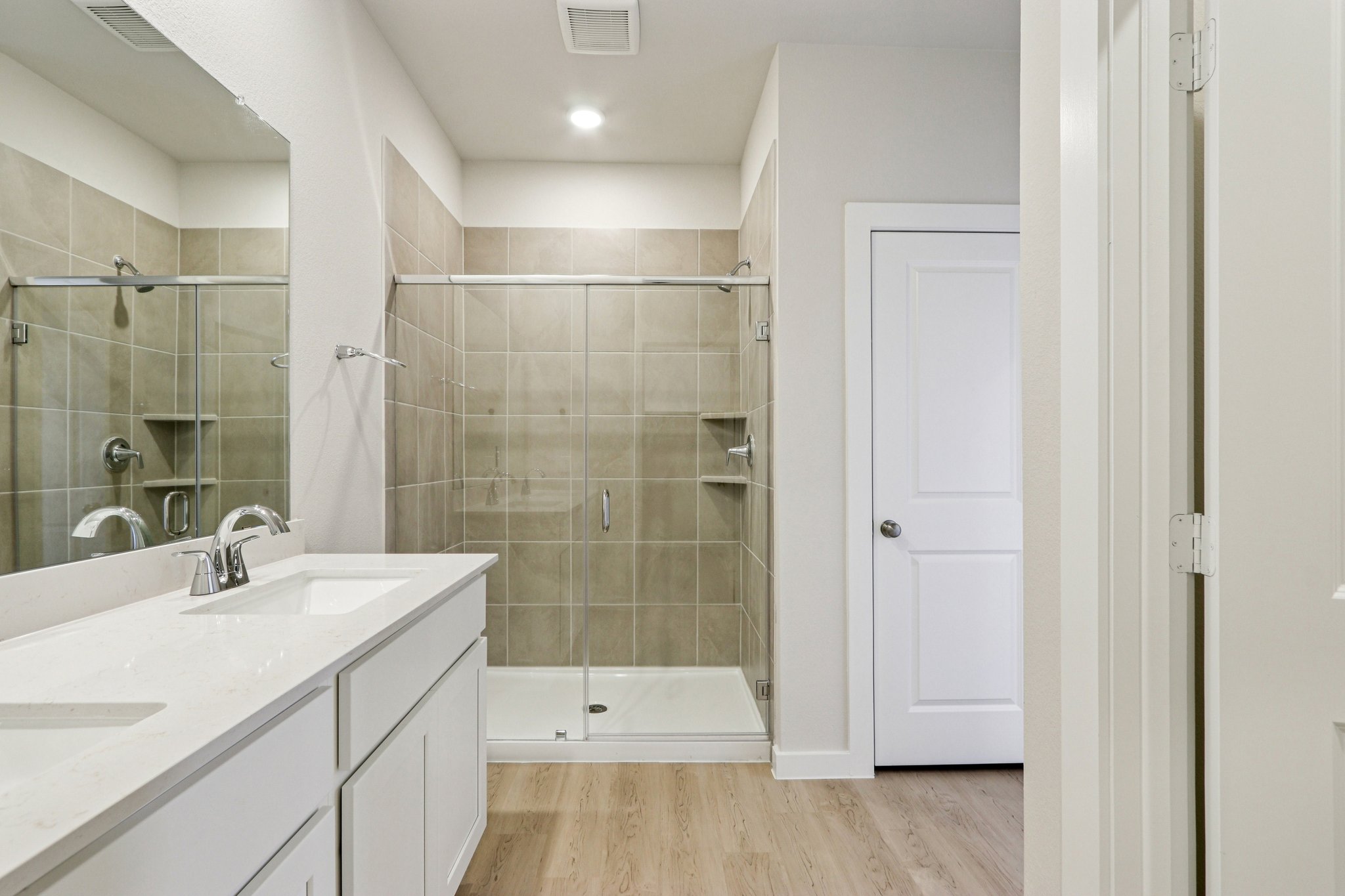 A bathroom with a glass shower.