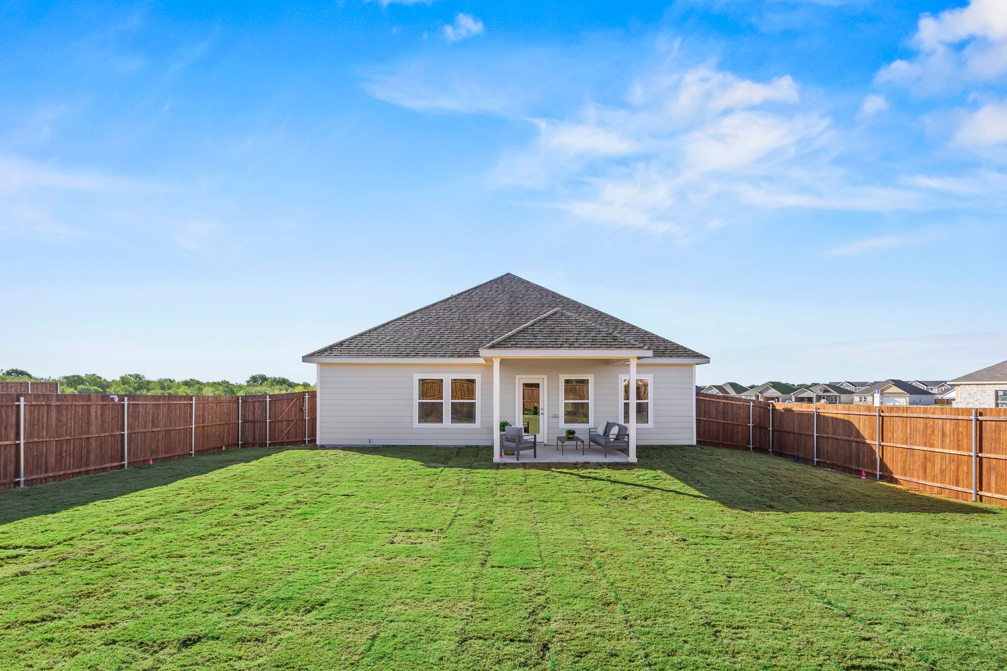A house with a fence around it.